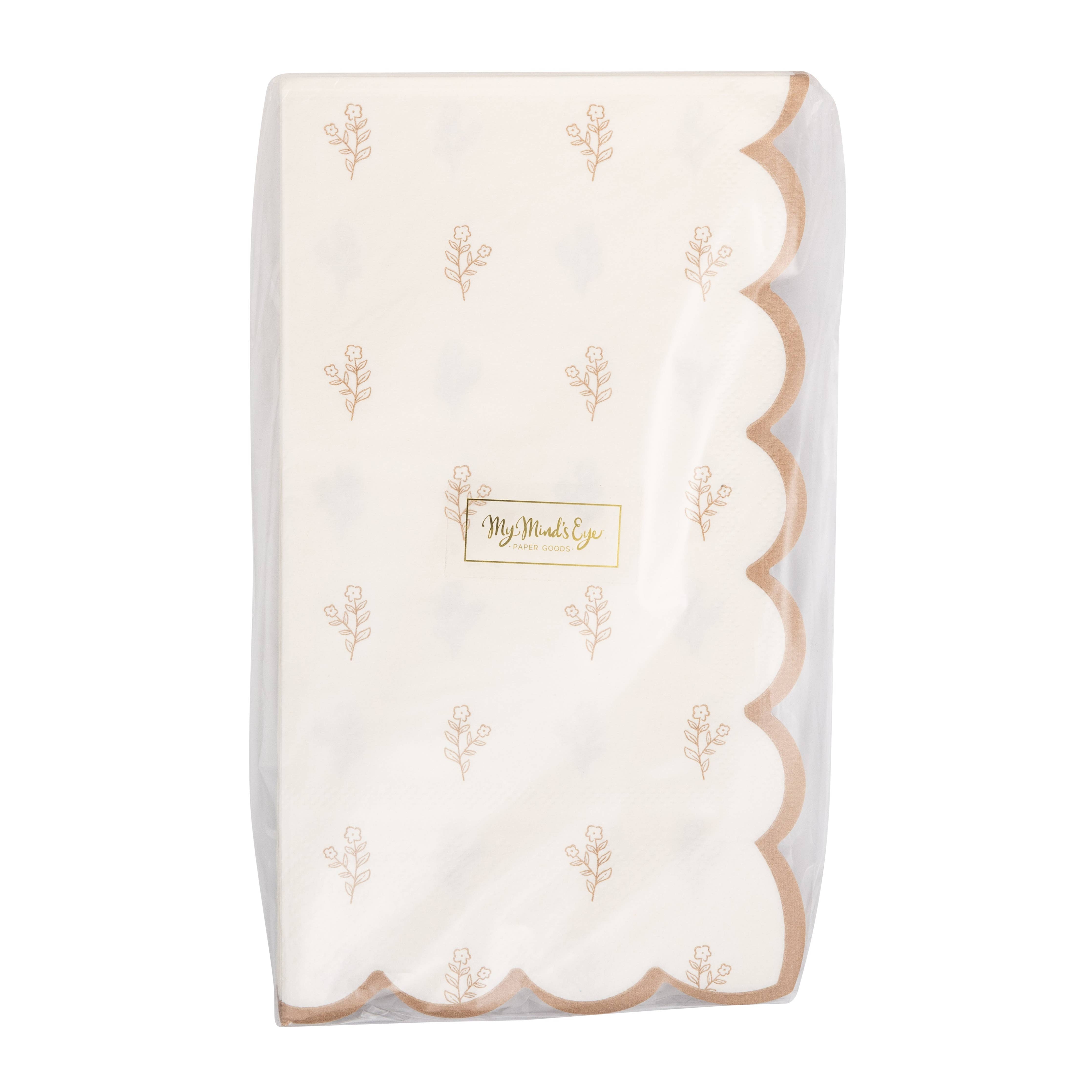 Packaged Cottontail floral Easter napkins with scalloped edges
