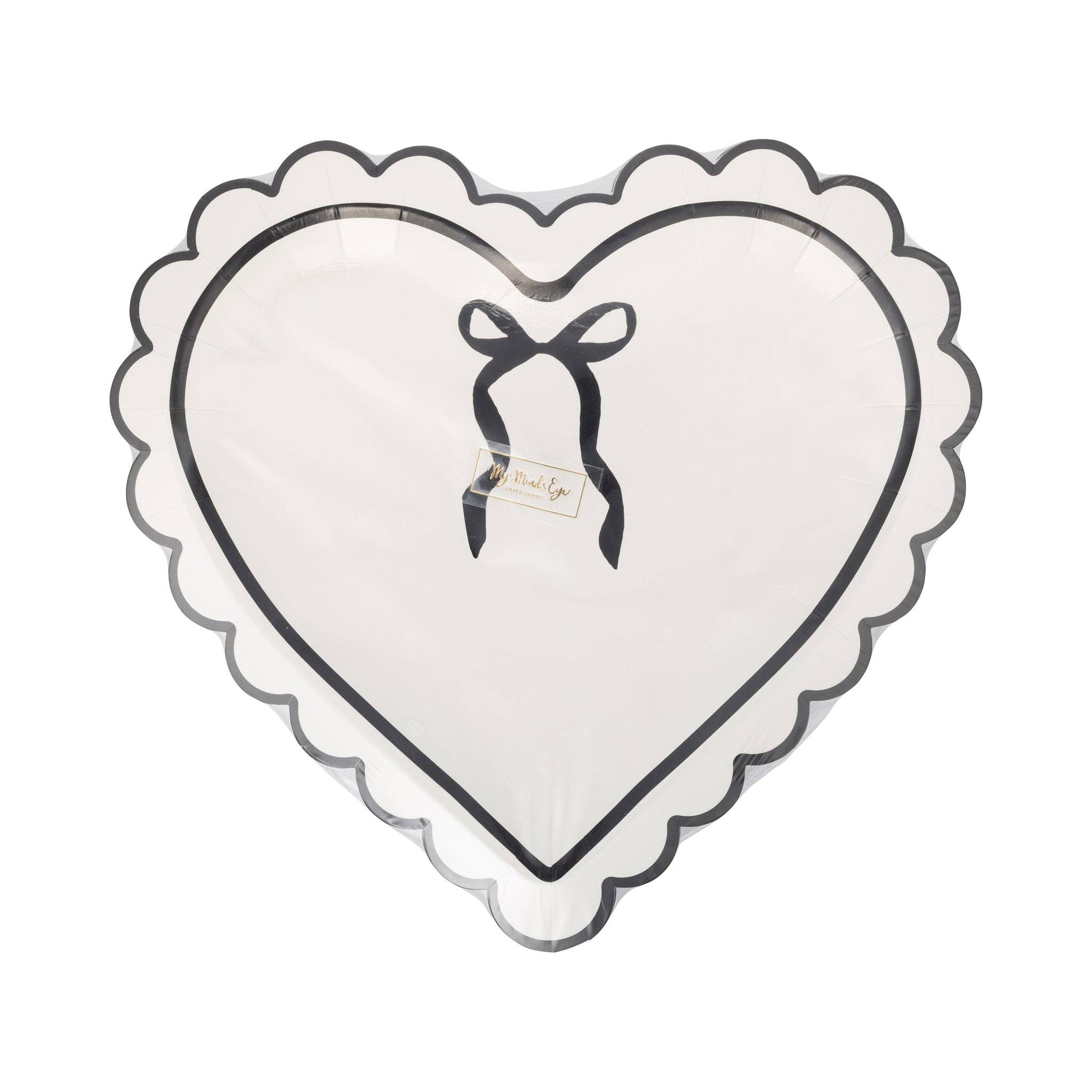 Packaged set of cream and black scalloped heart-shaped plates.