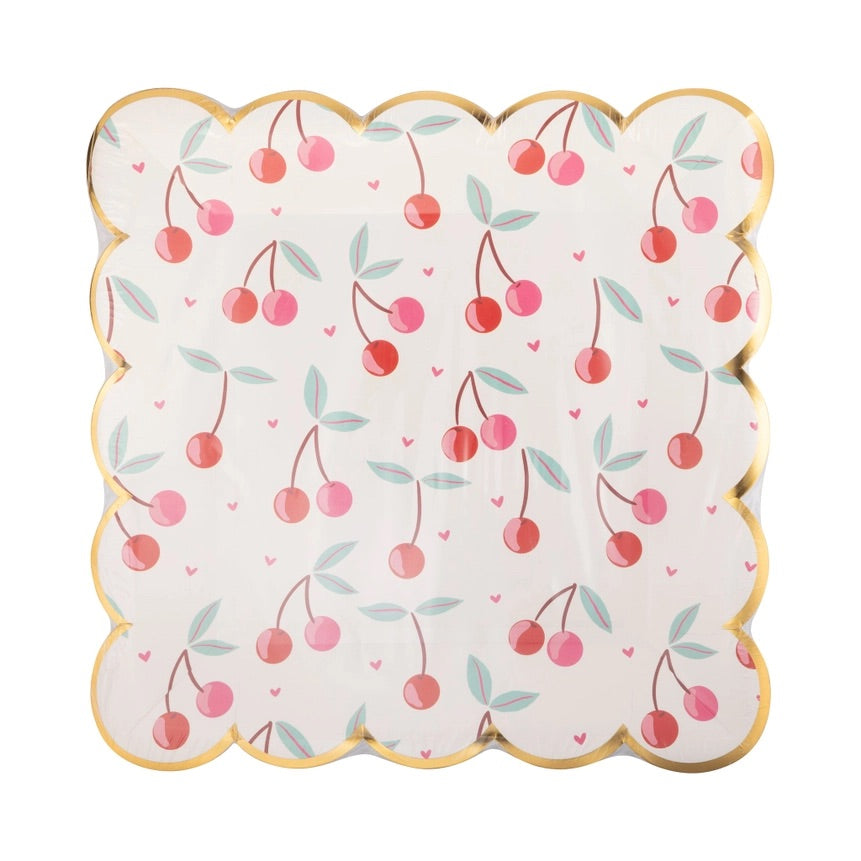 Packaged set of square scalloped paper plates decorated with pink and red cherries and gold foil edging, ideal for cherry-themed celebrations.