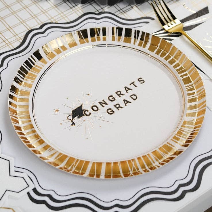 A Congrats Grad plate featuring a black and white striped border, perfect as a Commencement Dessert Bar staple.