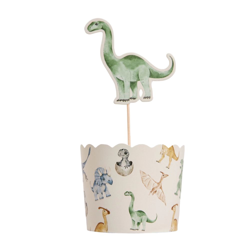 Dinosaur cupcake with topper pick inserted into liner
