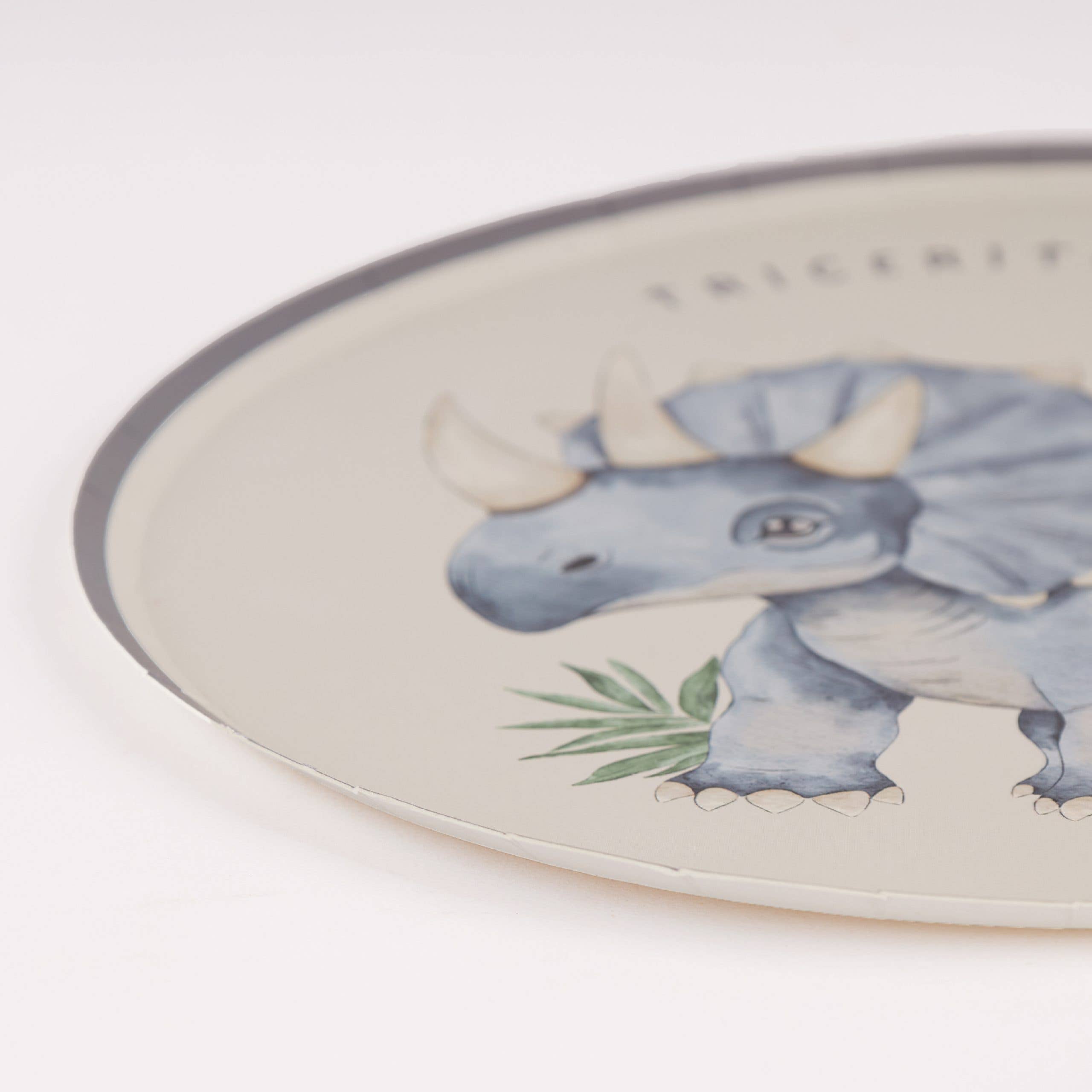 Side profile of a sturdy watercolor dinosaur plate