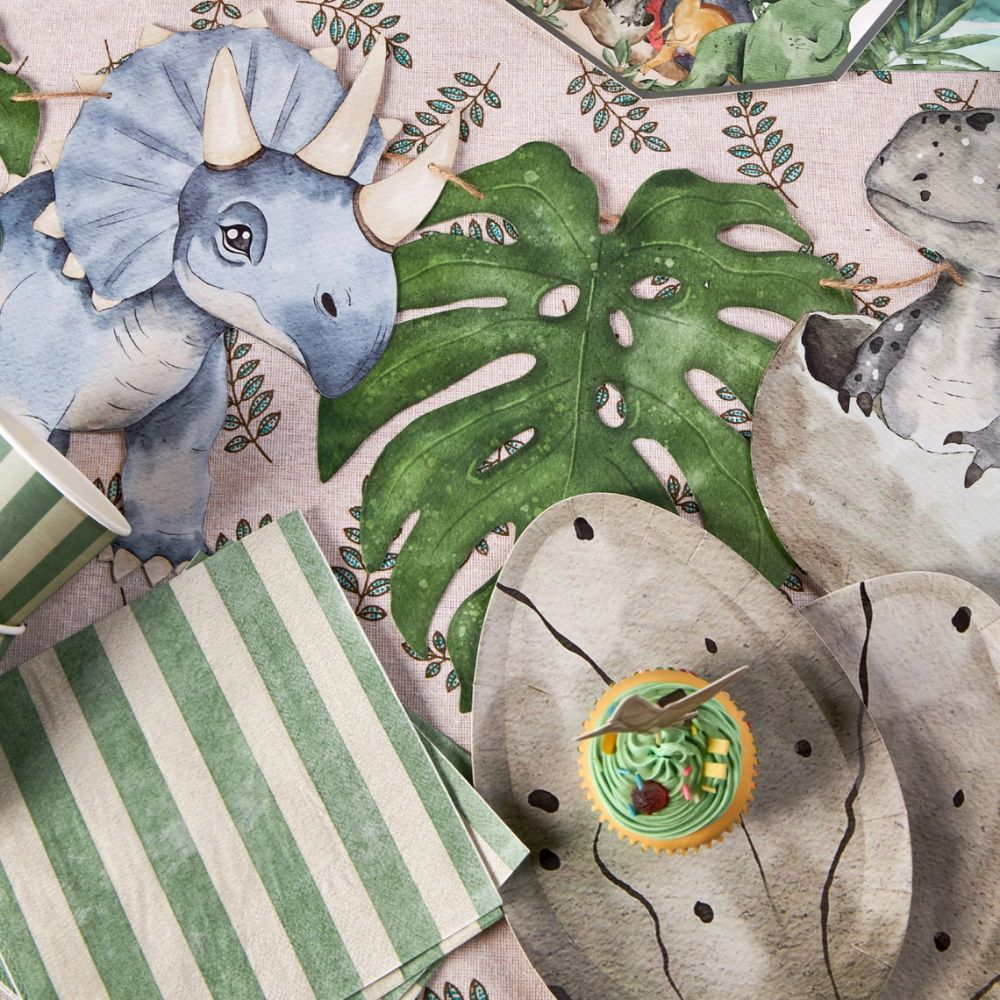 Dinosaur egg plates styled with cupcake and dinosaur party decor