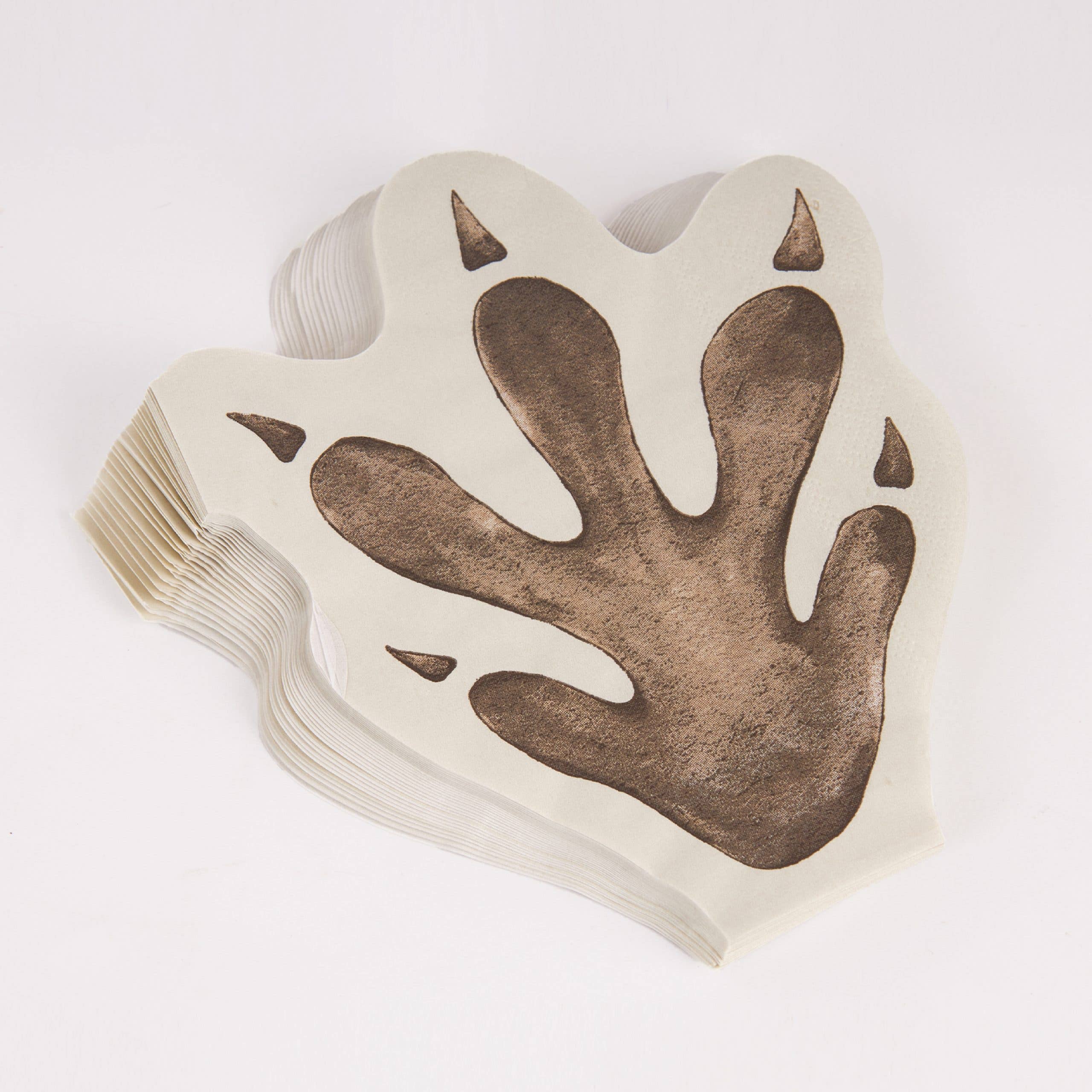 Pile of dinosaur footprint napkins showing quantity
