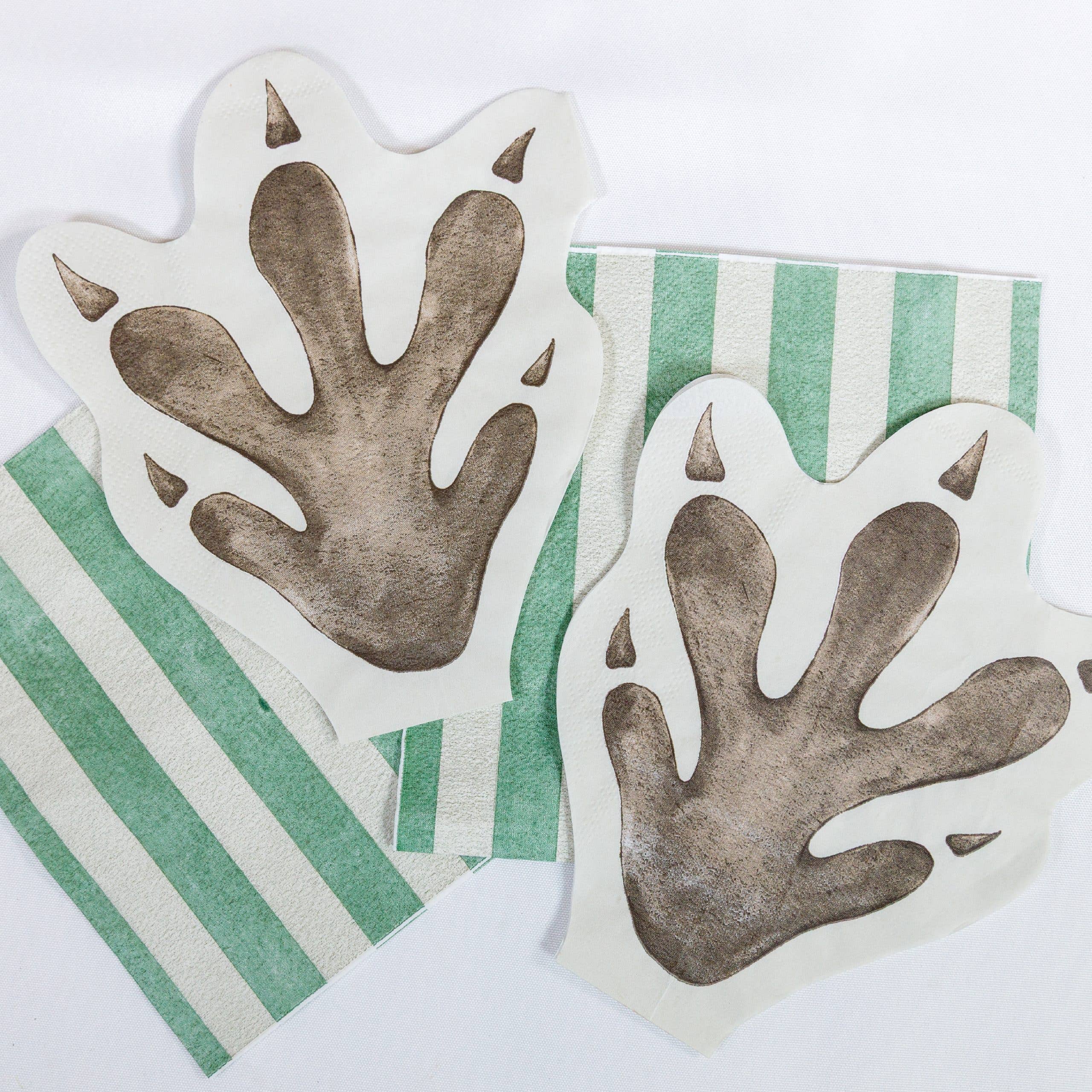 Dinosaur footprint napkins with green striped napkins
