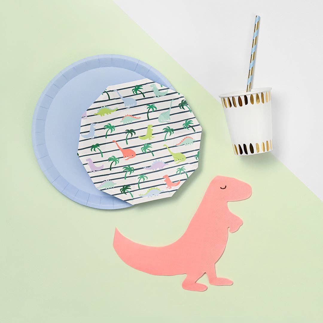 Dinosaur plate styled with matching party supplies and cup.