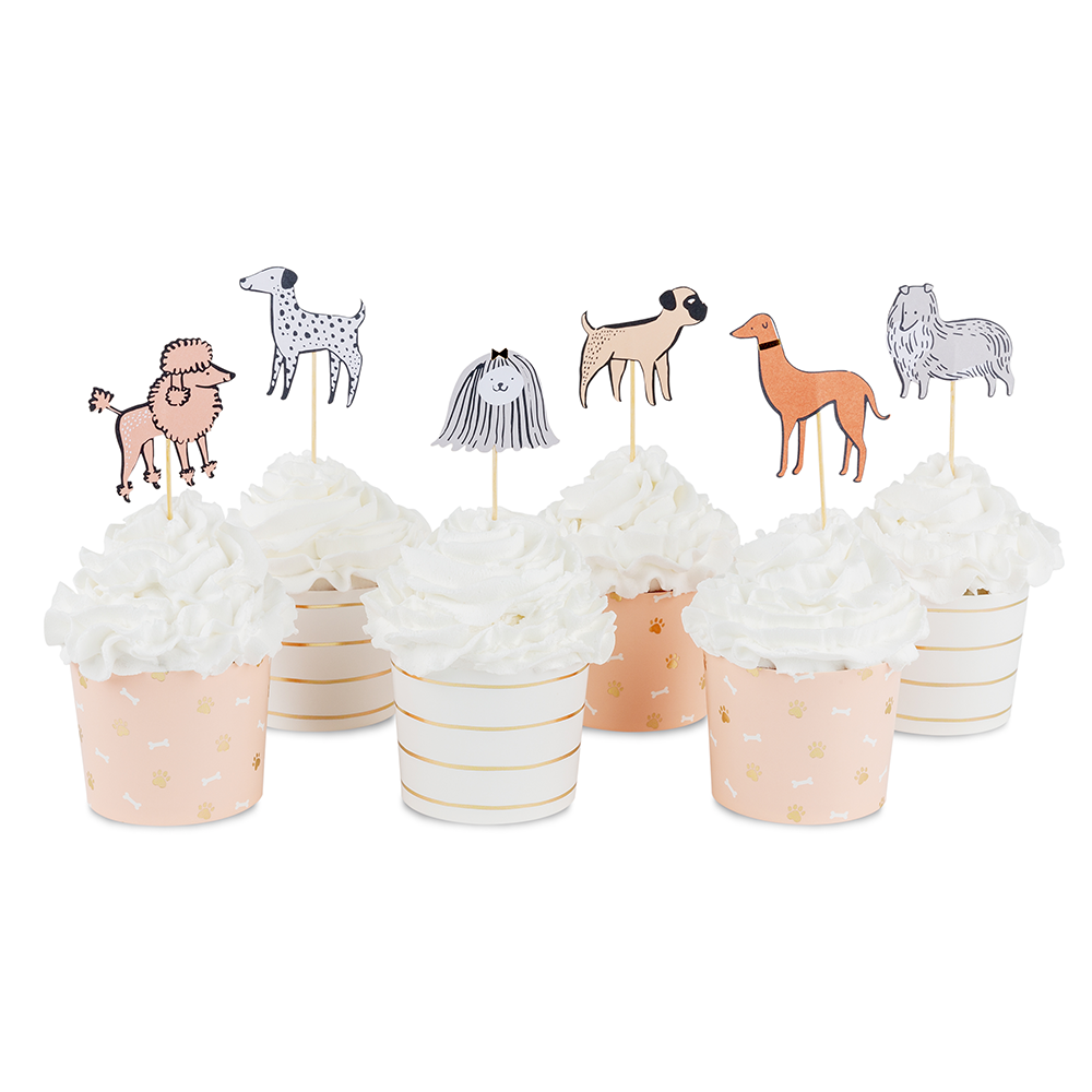 Dog cupcake toppers displayed on frosted cupcakes with coordinating baking cups