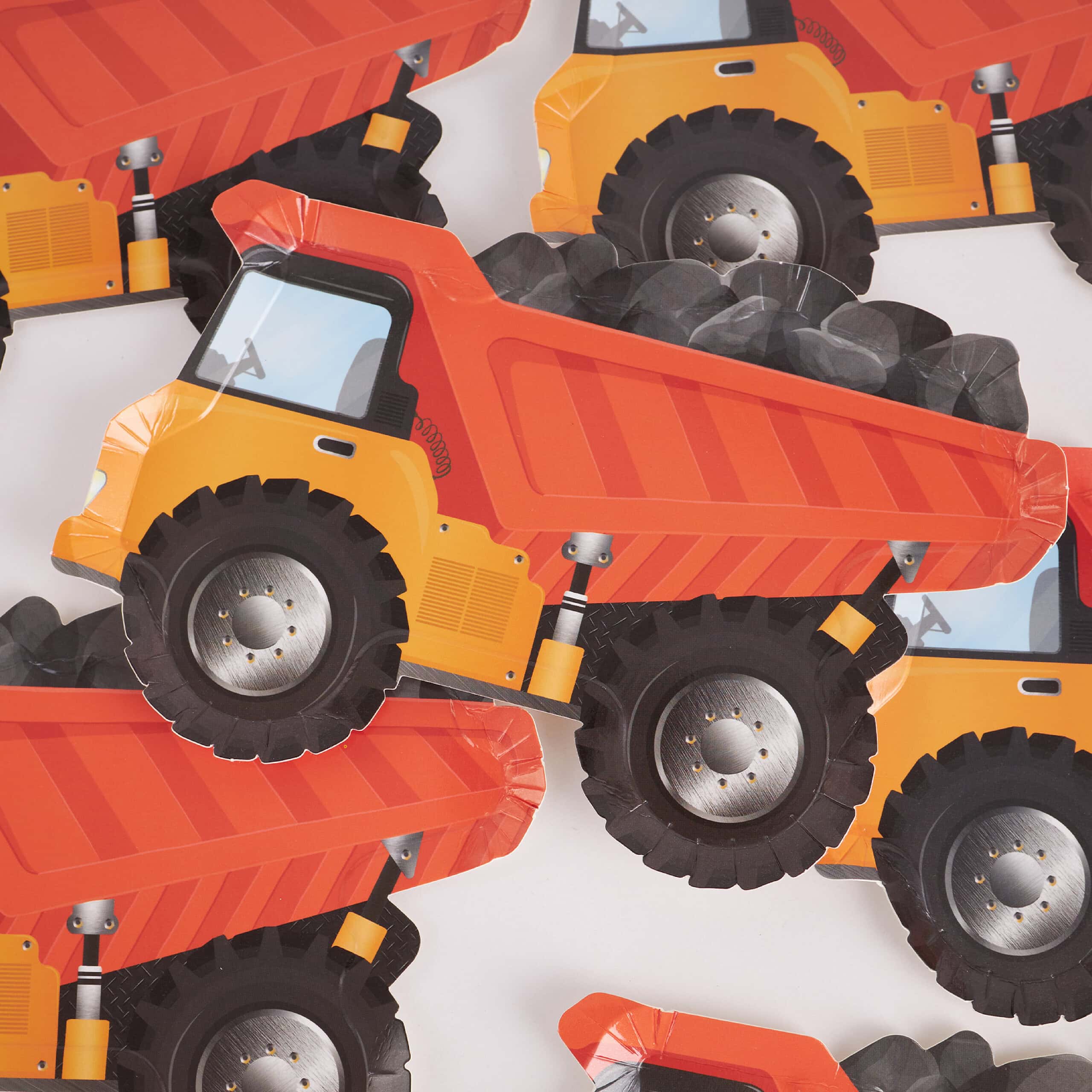 dump truck party plates stacked on top of each other