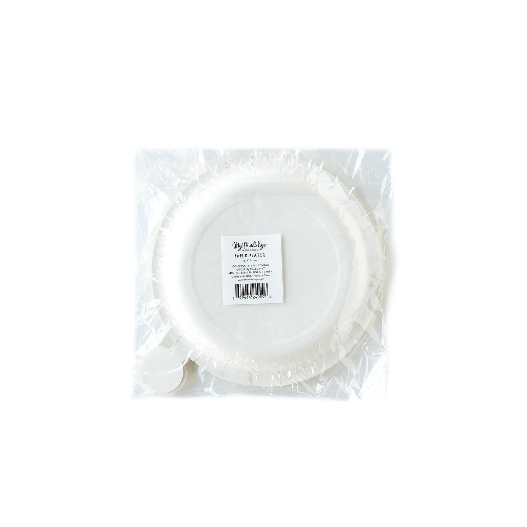 A clear plastic package containing 8 cream-colored compass-shaped paper plates, labeled with product details on a centered sticker.