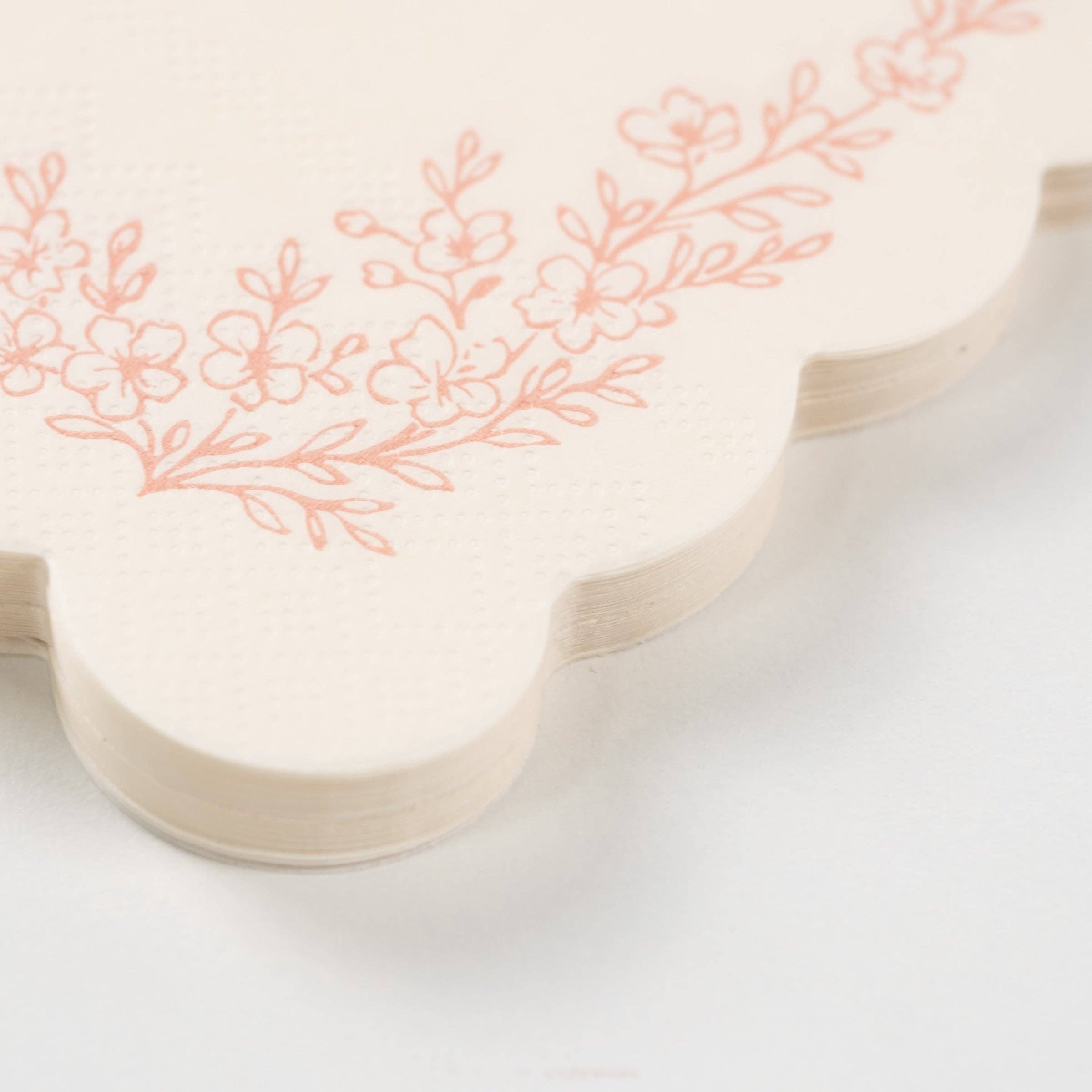 Macro shot of the premium embossed paper texture and scalloped border