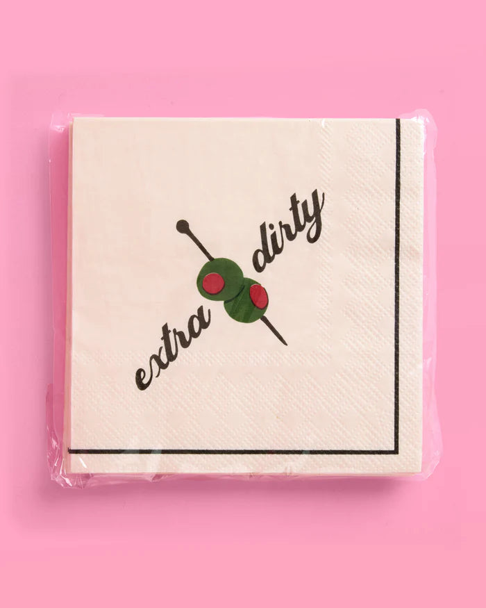 Pack of extra dirty martini paper cocktail napkins in clear packaging on a pink background