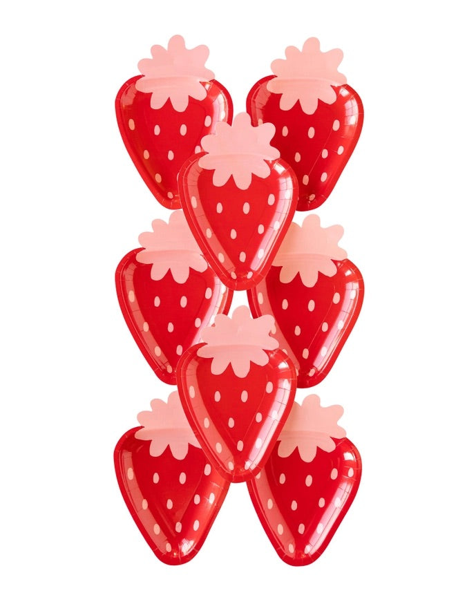 Set of vibrant red and pink strawberry-shaped paper plates stacked neatly, perfect for berry first birthday decorations.