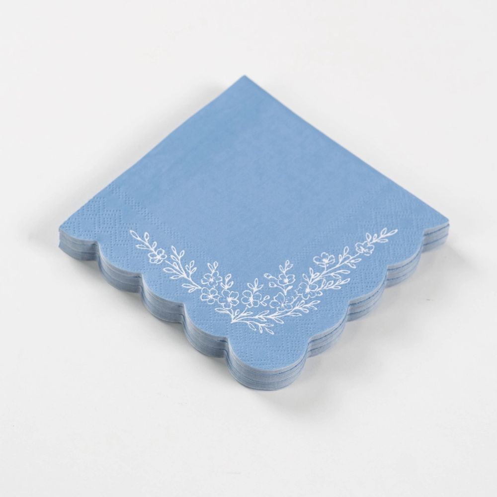 stack of floral beverage napkins blue
