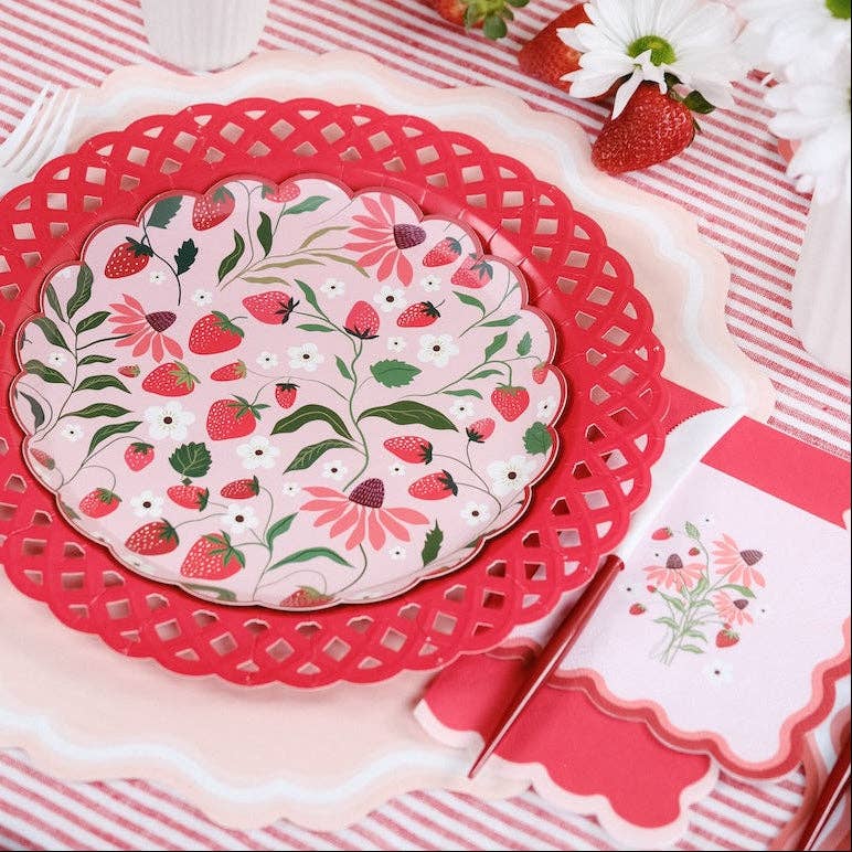 Strawberry Paper Plate styled with red handled utensils and a floral napkin for a Garden Party.