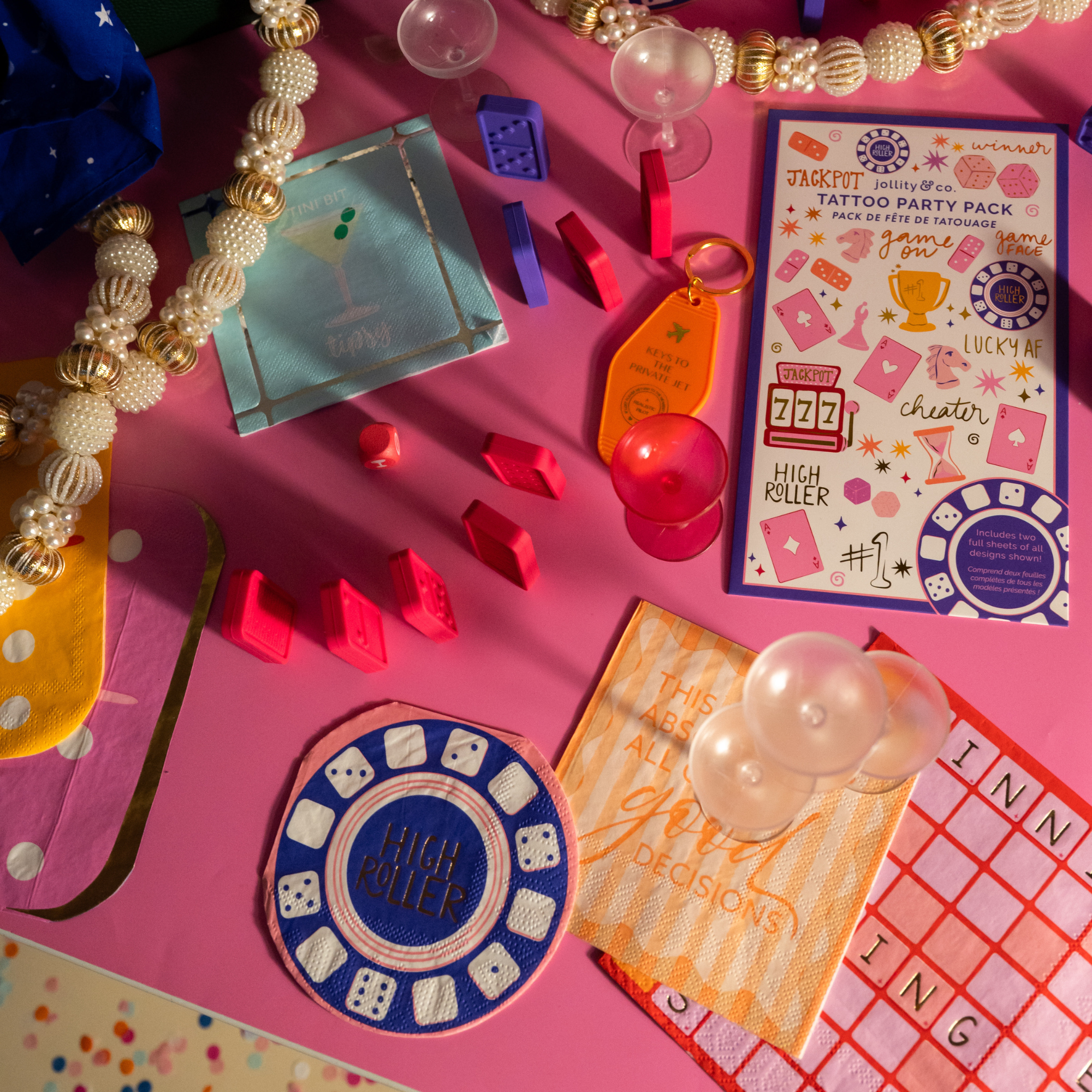 Girls night party table with cocktail napkins, drinks, and colorful decor
