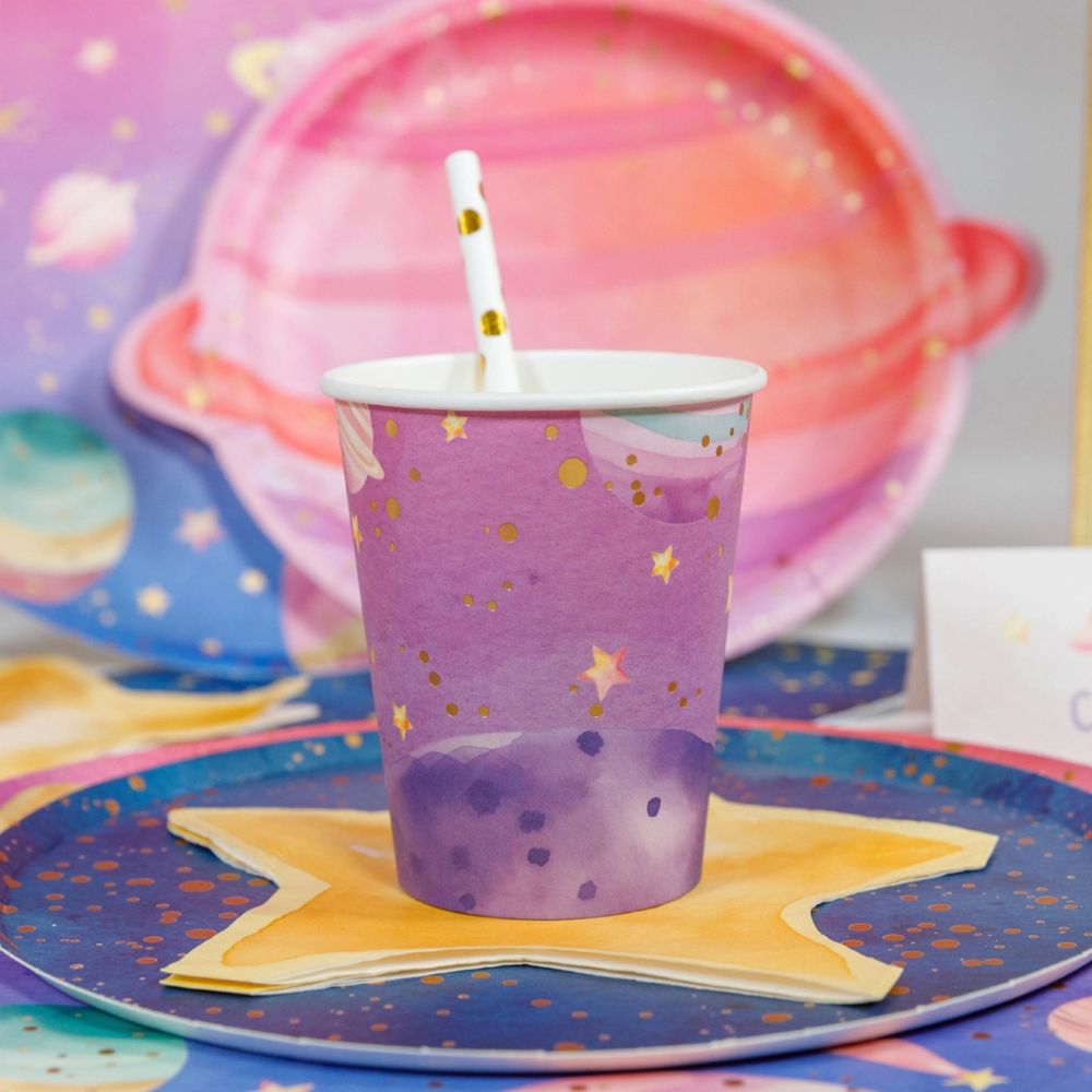 galaxy paper cup on space themed table with star napkin and straw