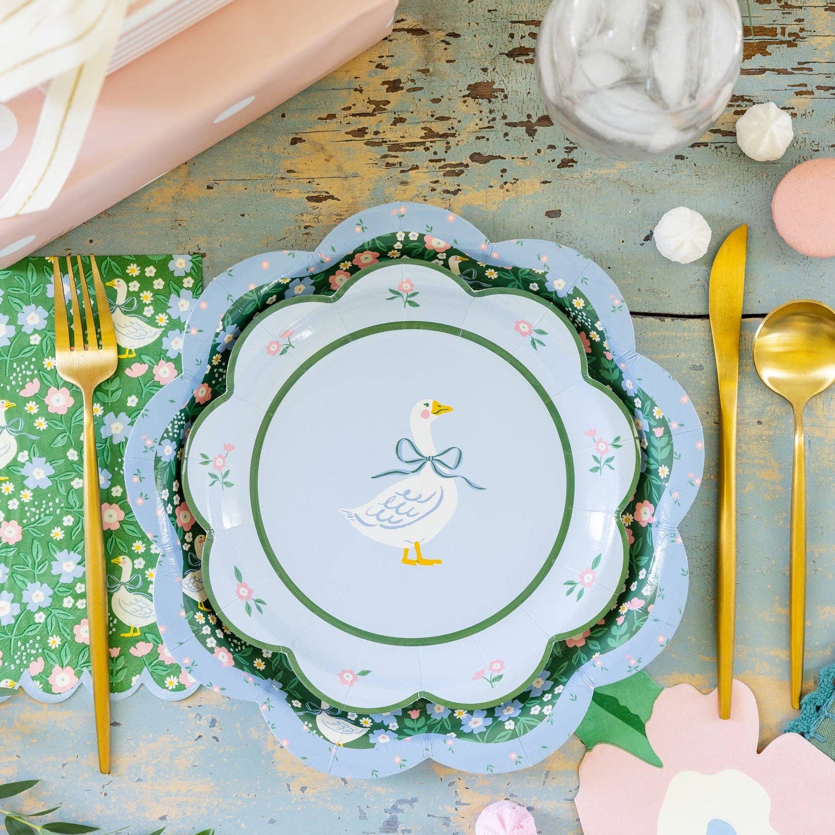 Garden Goose napkin styled with layered plates and gold flatware