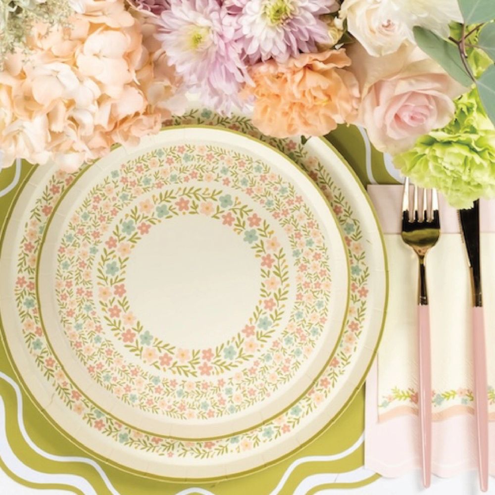 garden party dinner plates styled with flowers and table setting.