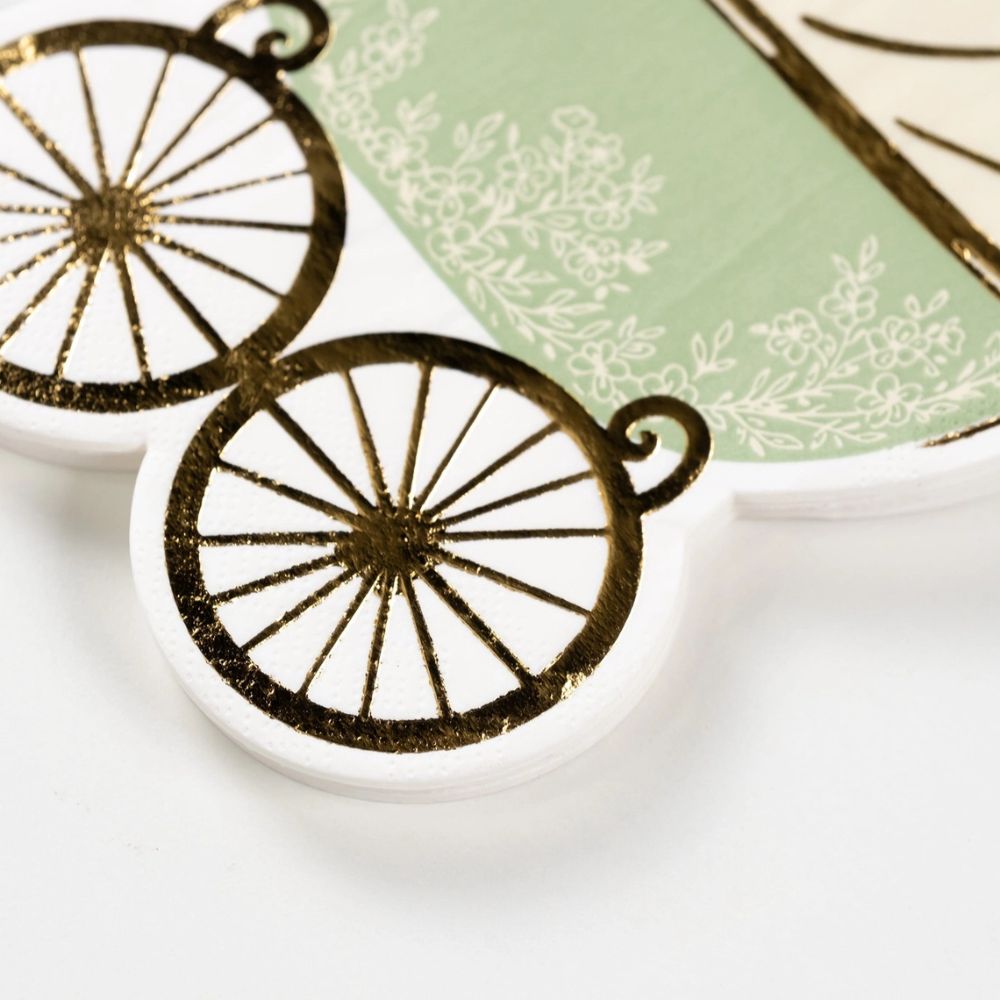 close up of gold foil wheels on napkin.
