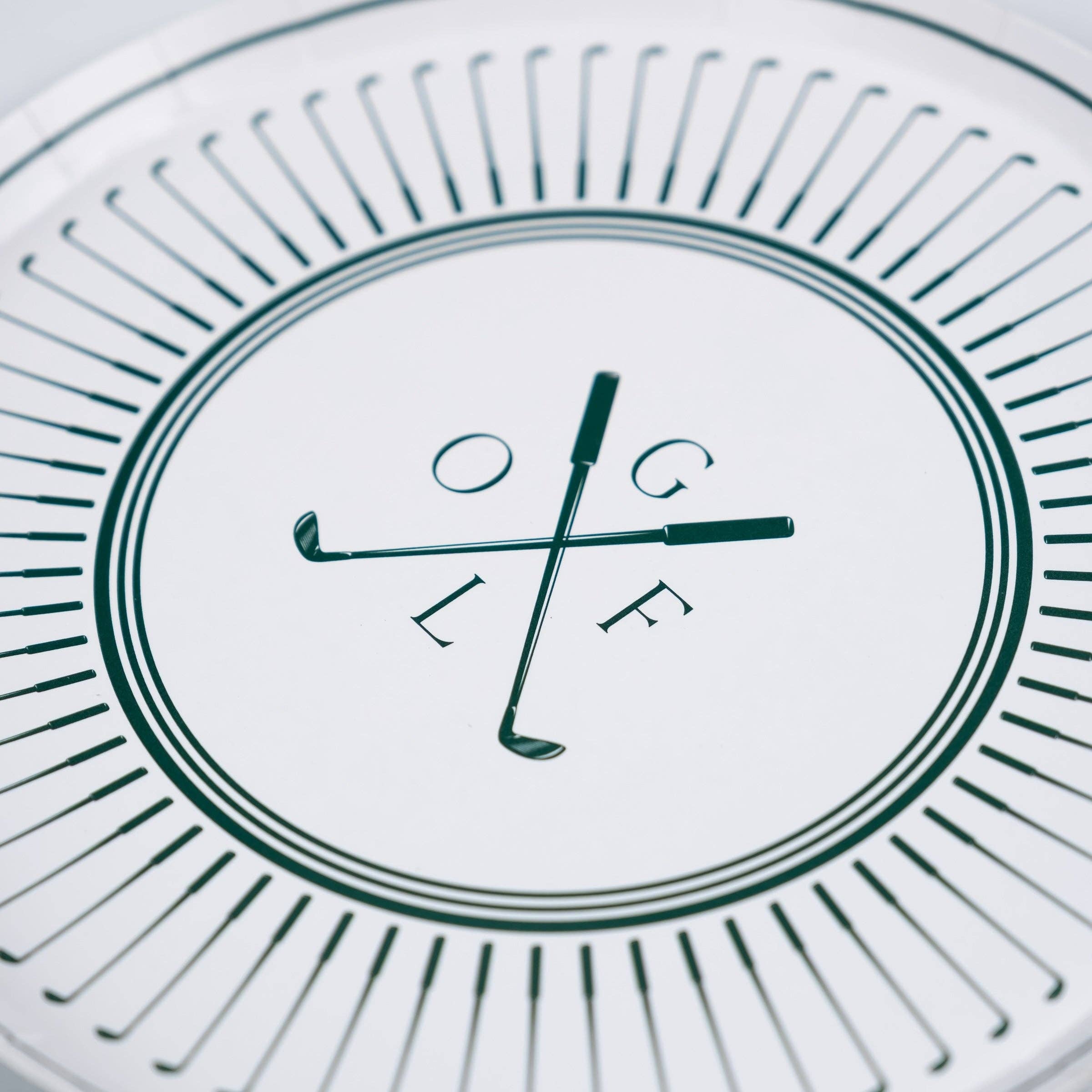 Close-up of crossed golf clubs and GOLF lettering on plate center