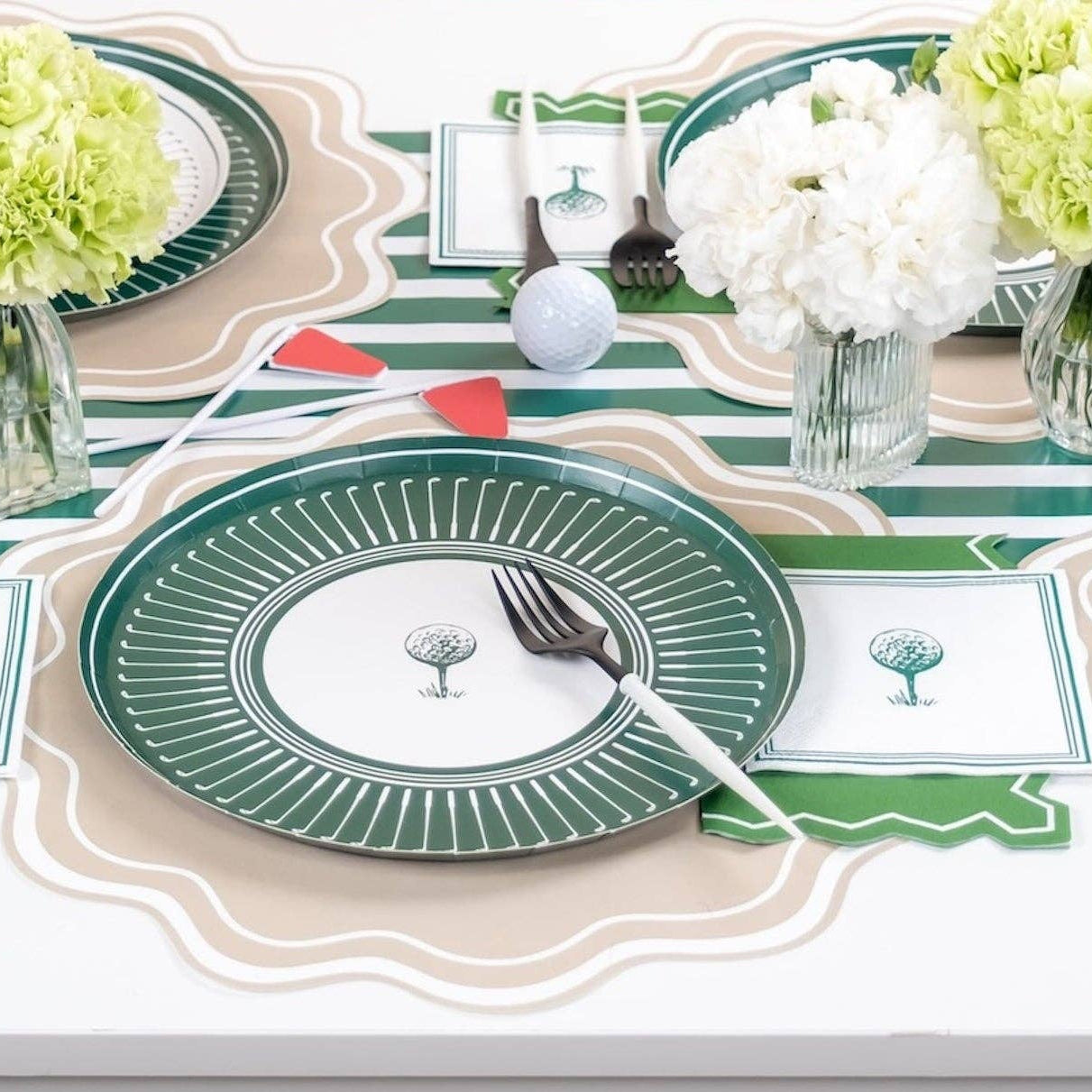 Golf party table with dark green party supplies