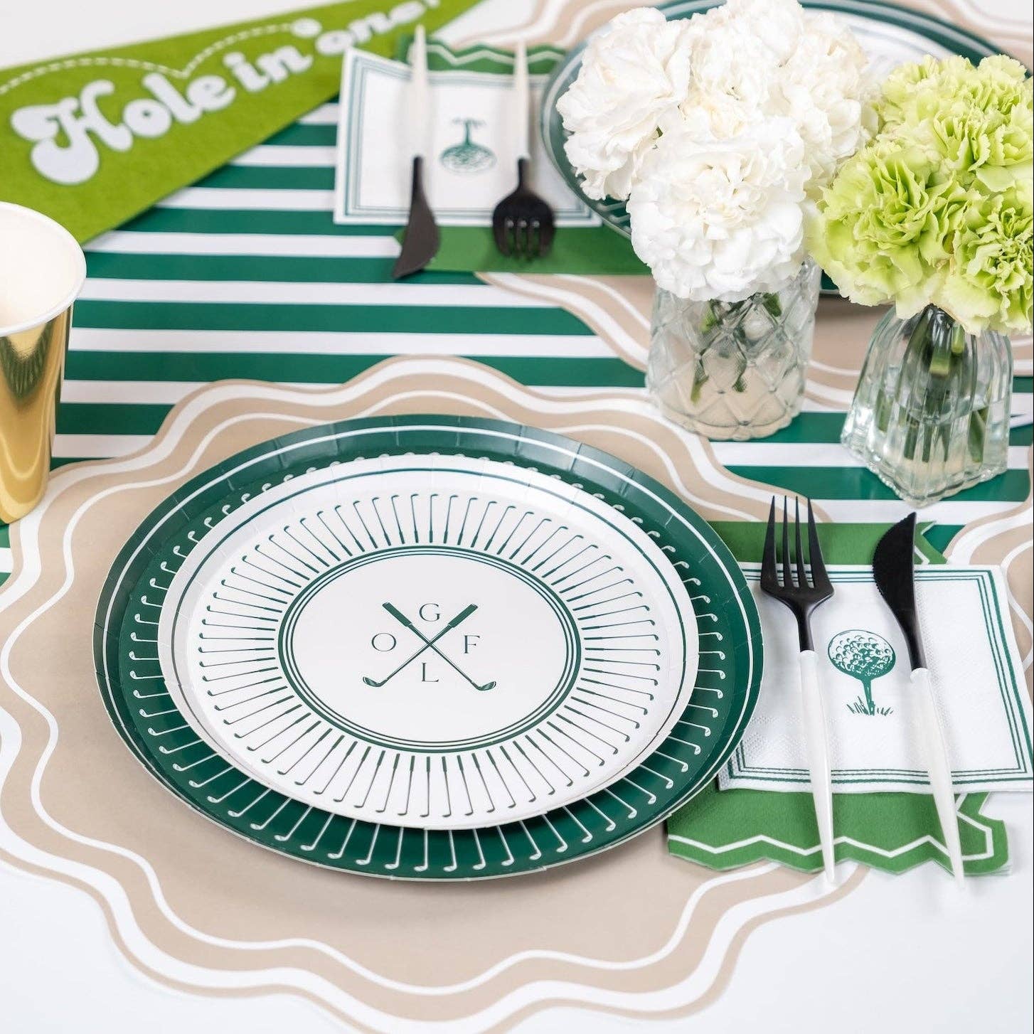 Green striped runner used on a country club–style party table with decorations