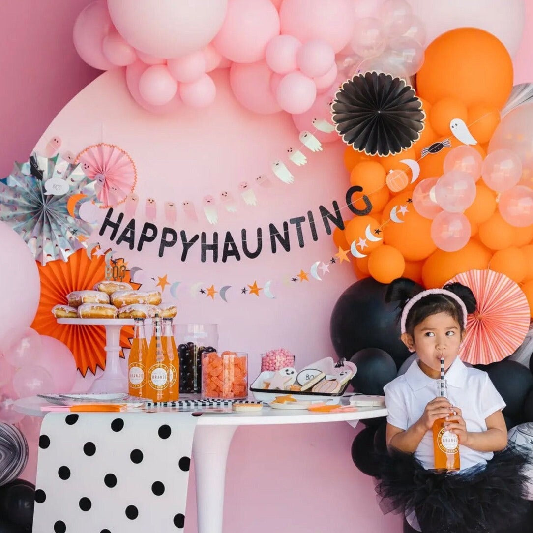 fun halloween party decorations in orange, black and pink