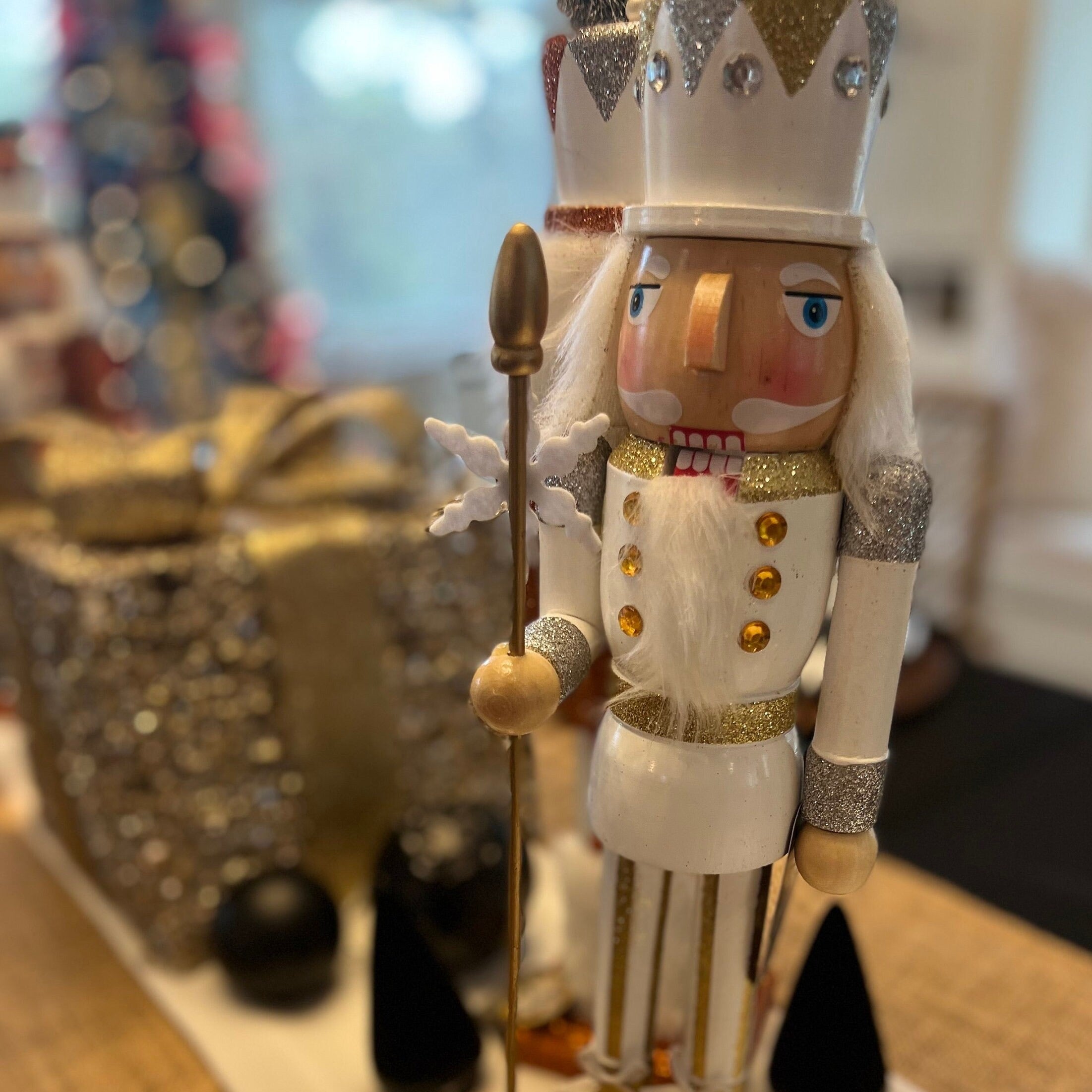 Gold and white Christmas nutcrackers perfect for a Christmas tablescape or Christmas coffee table decor.