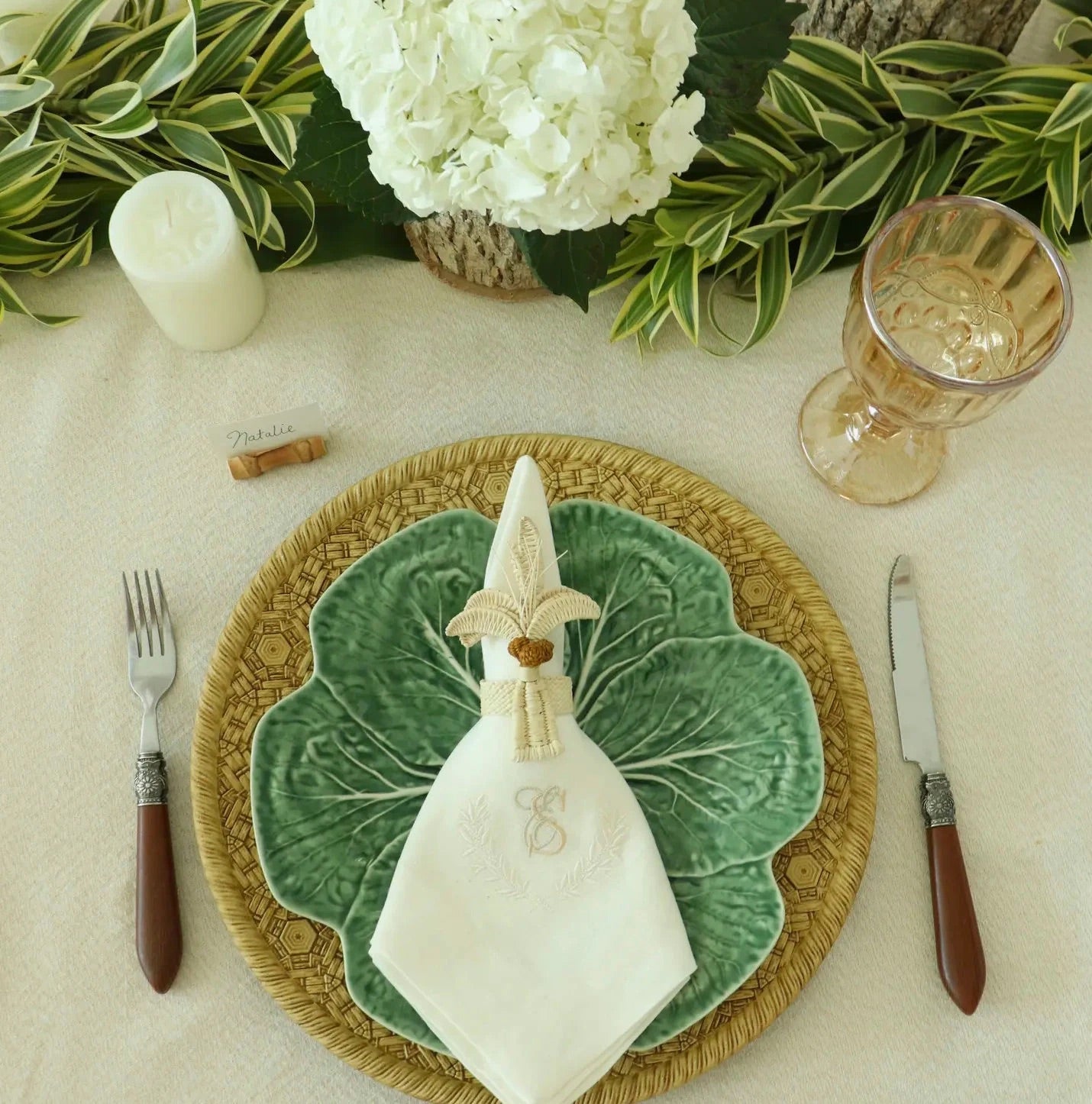 Escape to the tropics at every meal with our woven Palm Tree Napkin Rings. Crafted to complement your tropical table decor, these napkin rings feature natural-colored palm trees with brown coconuts, adding a coastal touch to your table. Perfect for hosting a luau or simply spicing up dinner, these palm tree napkin rings offer an instant vacation vibe.