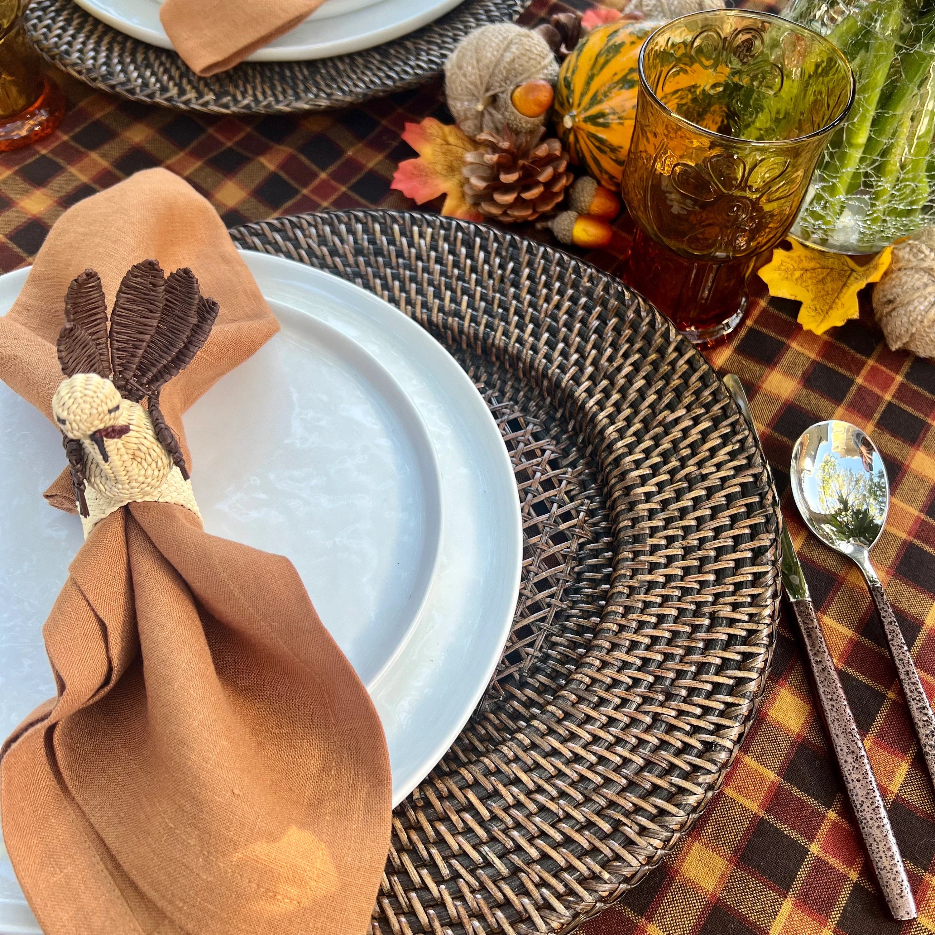 Discover the perfect blend of style and functionality with our Dark Brown Rattan Charger Plates. Crafted from natural wicker, these handmade boho charger plates fit standard dinner plates and add a chic, rustic touch to any meal. Ideal for those seeking brown placemats that combine durability with aesthetic appeal.