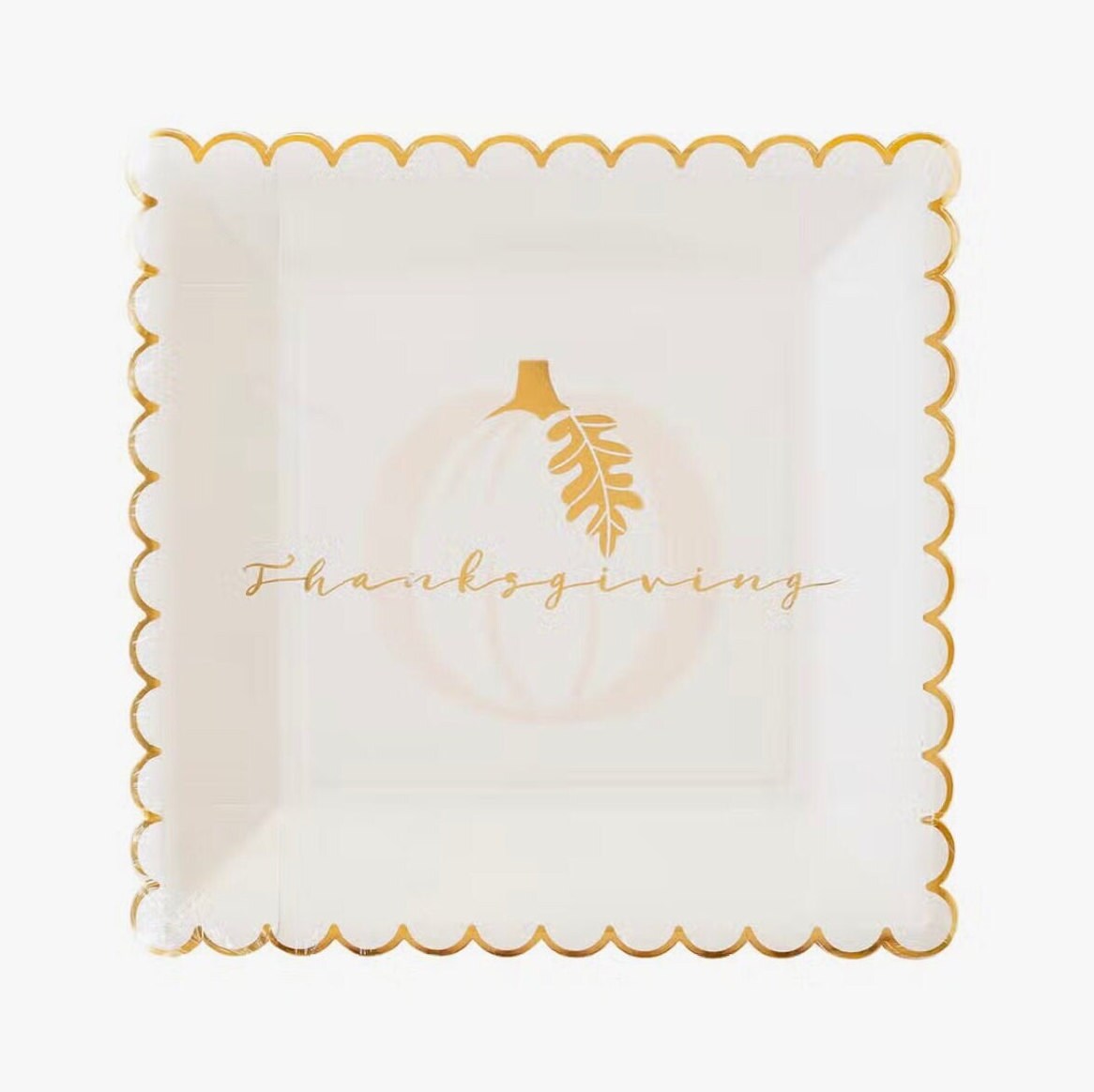 Thanksgiving paper plates featuring a gold foil edge and a pumpkin.