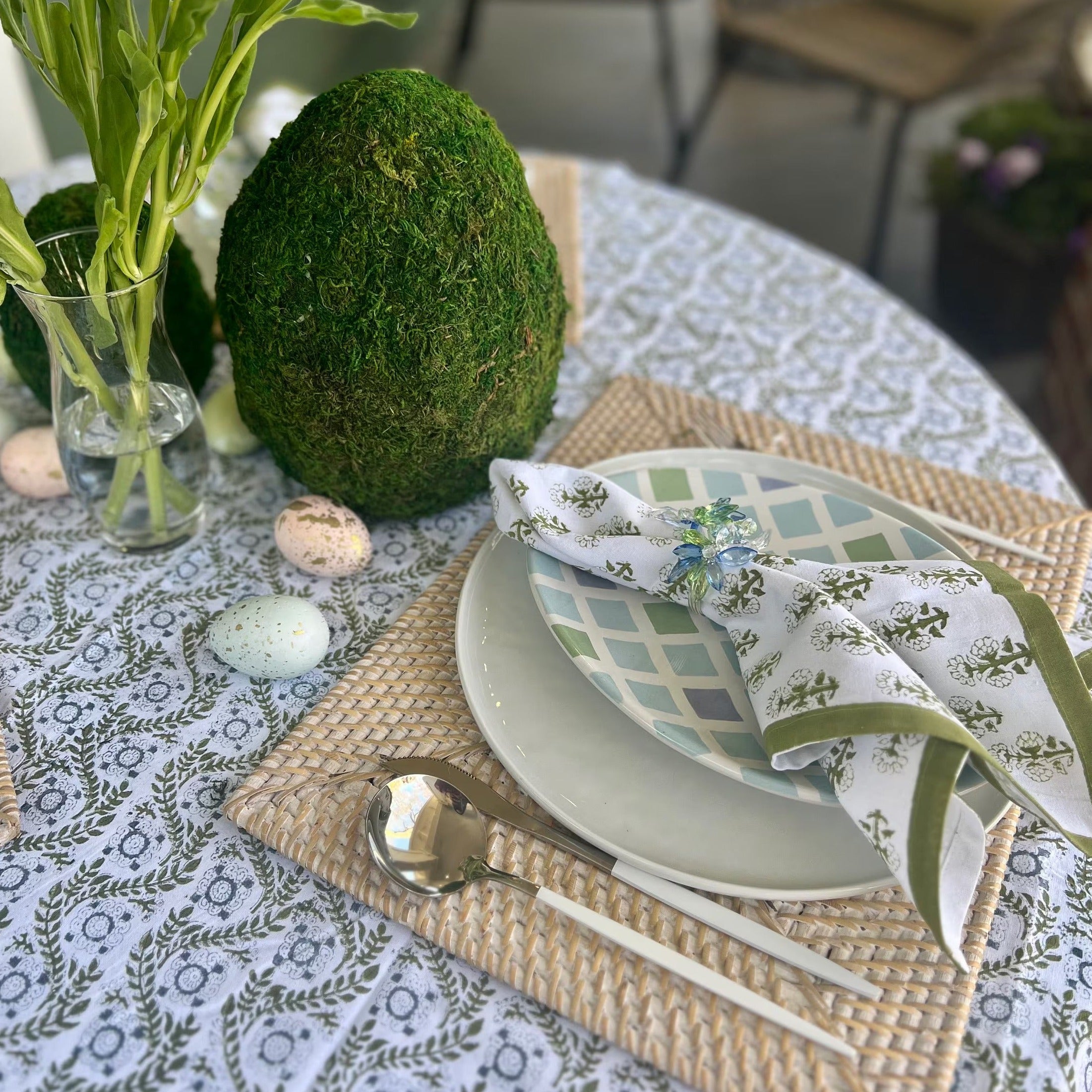 Green cloth napkins with a floral design and matching green border - perfect for a Spring table or Easter tablescape.