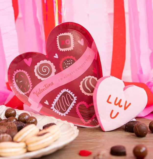Red and pink paper cocktail napkins shaped like a heart and the words love u; perfect for a anniversary party, bachelorette  or an engagement party