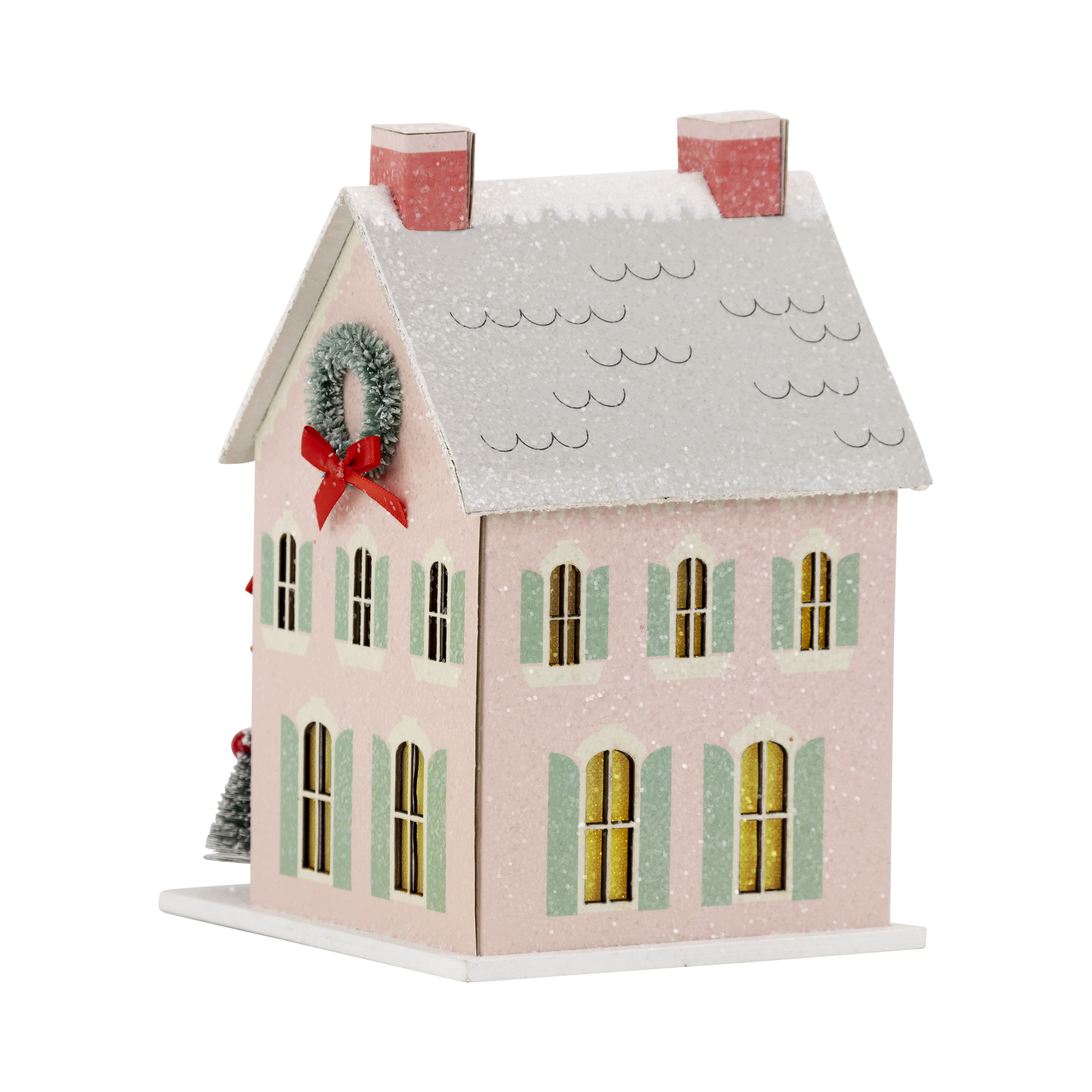 Isolated view of the pink glitter Christmas putz house showing the pale green shutters and snow-dusted roof.