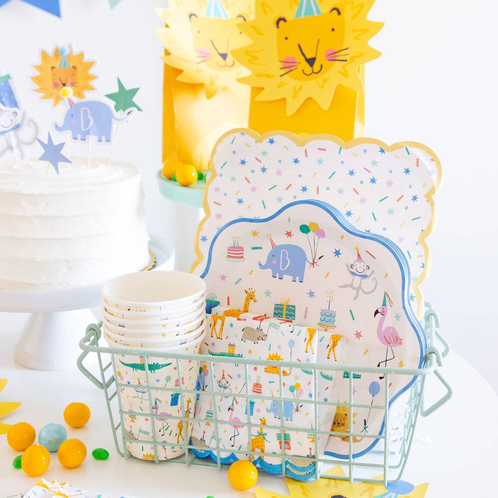 Animal party cups displayed with matching jungle party decorations