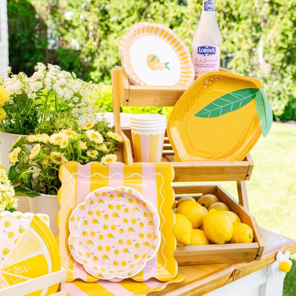 Summer party setup with striped square plates and lemons
