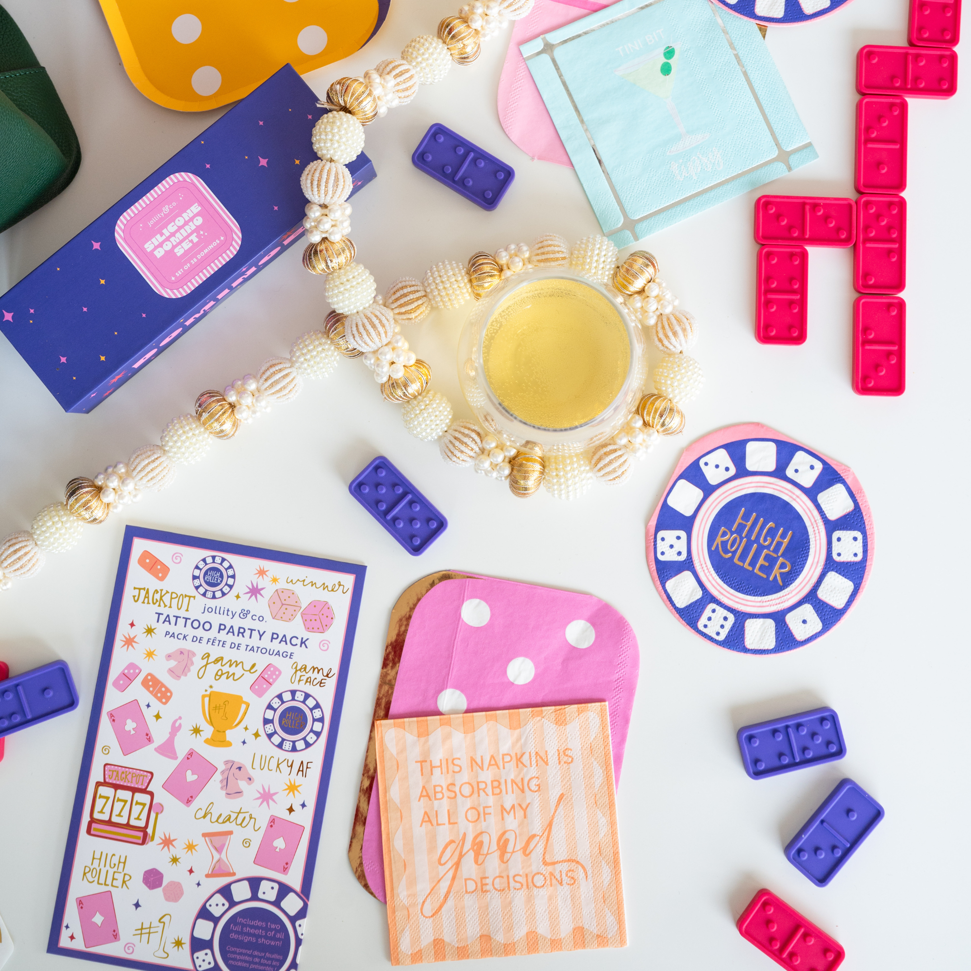 Cocktail party setup with martini napkin, dominoes, and party accessories