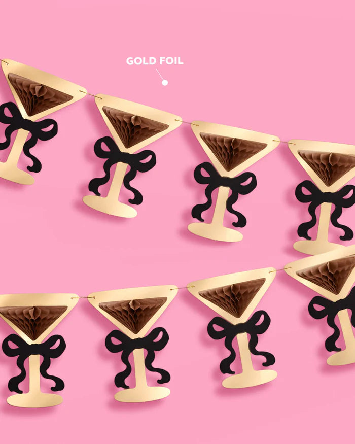 Close-up of gold foil martini glass banner pieces with black bow detail, labeled "gold foil"