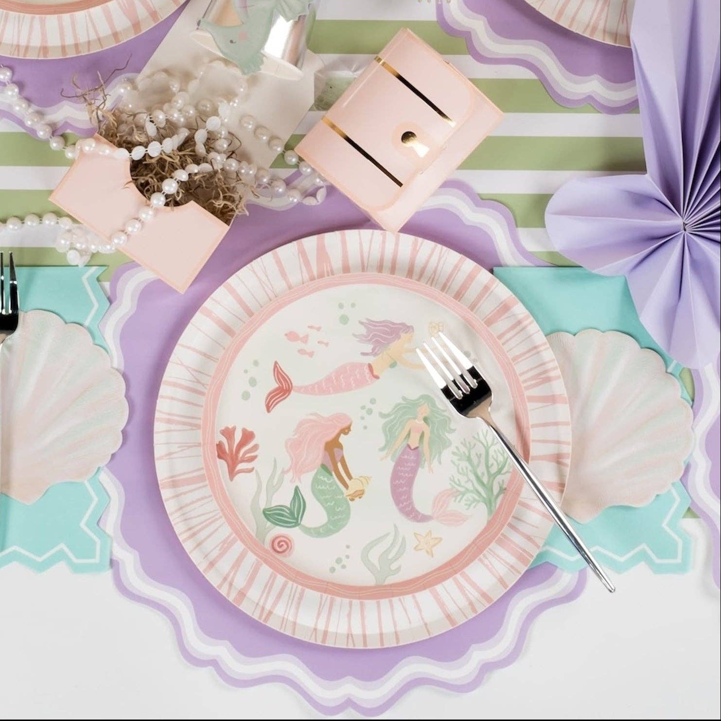 mermaid party napkins styled with full themed table arrangement.