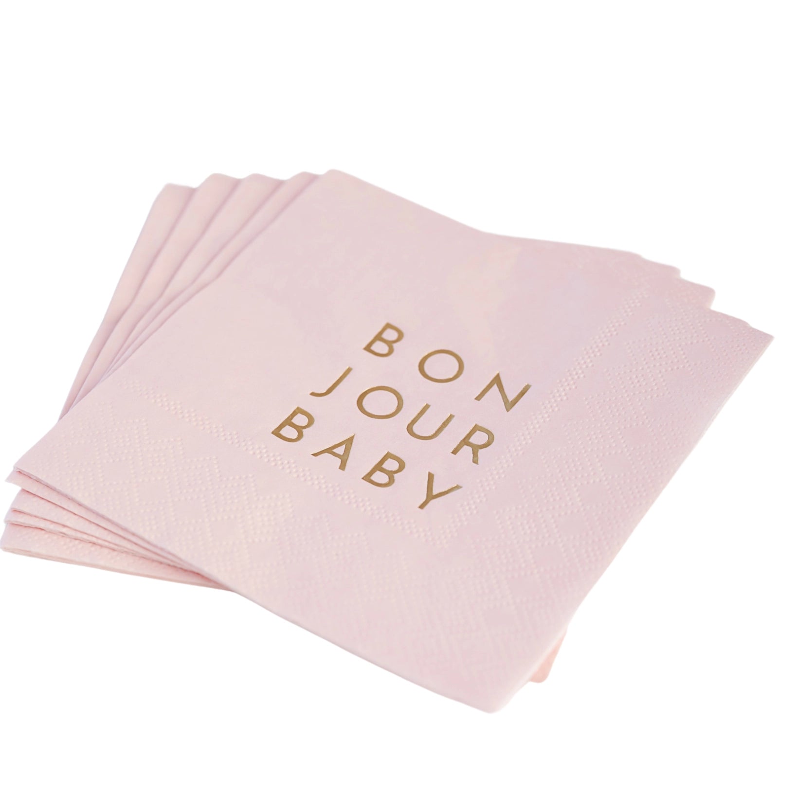 Blush cocktail napkin embossed with gold foil “BON JOUR BABY,” photographed flat on white background.