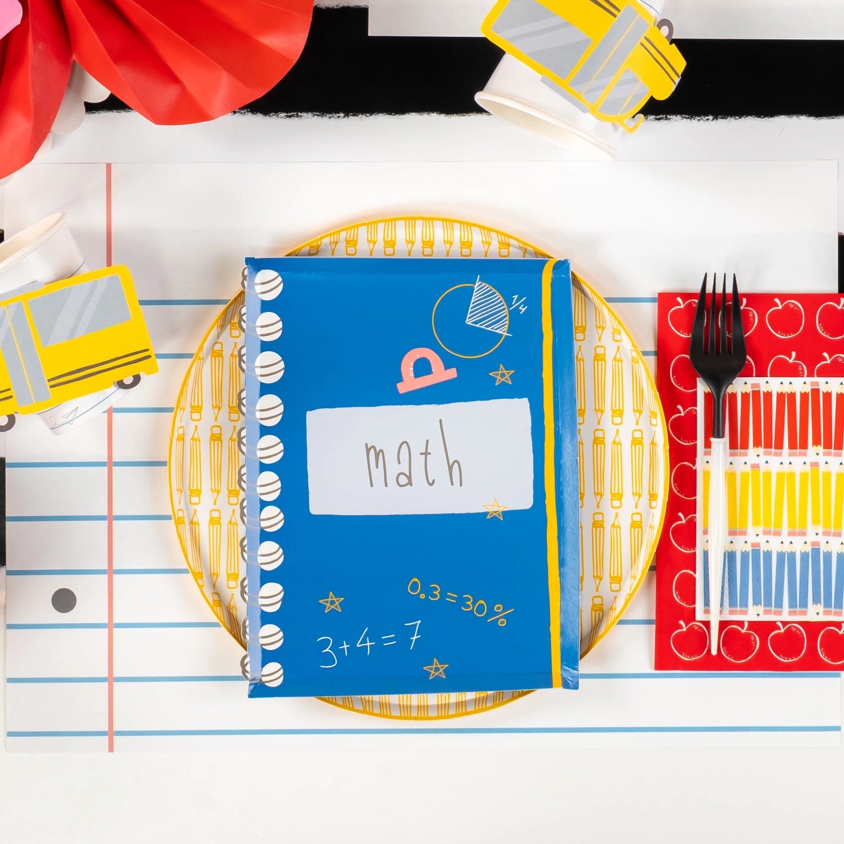 Blue ‘Math’ notebook plate with yellow pencil plate and pencil-striped drink napkin.