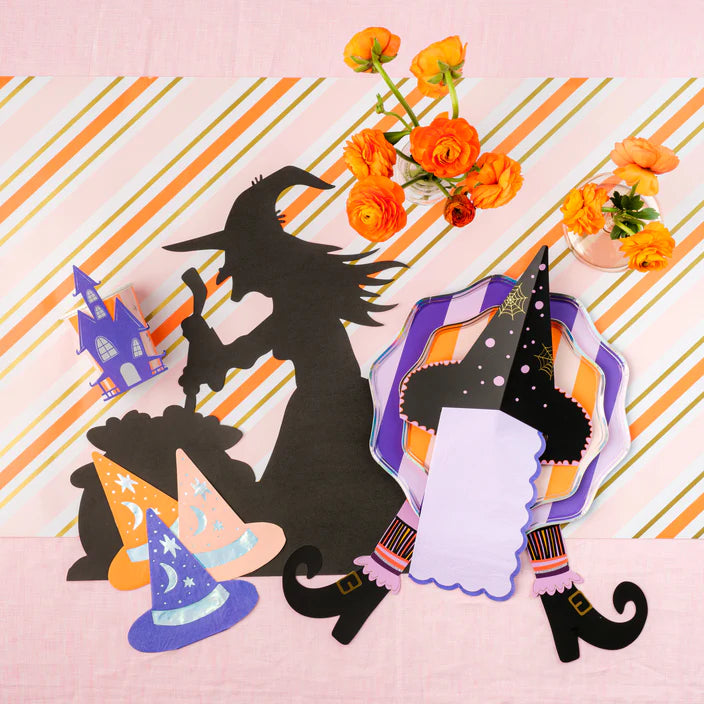 Flat lay with witch silhouette and florals featuring the purple striped dessert plate.