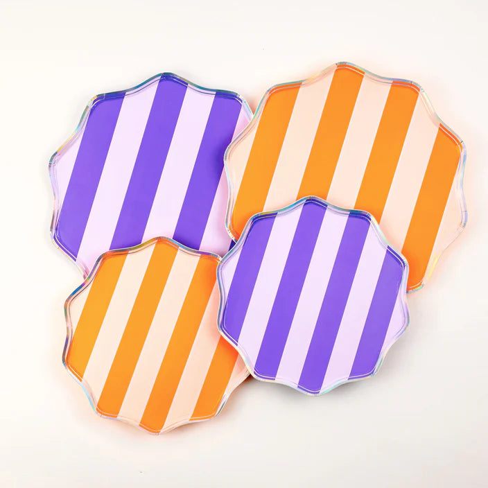 Set of four striped dessert plates in purple and orange colorways arranged together.