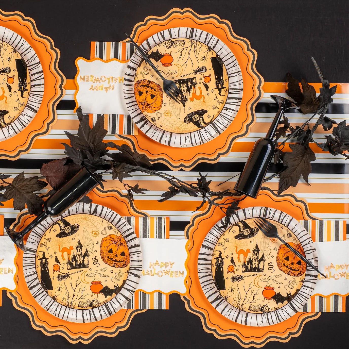 Vintage Halloween place settings with stripe guest towels down the center