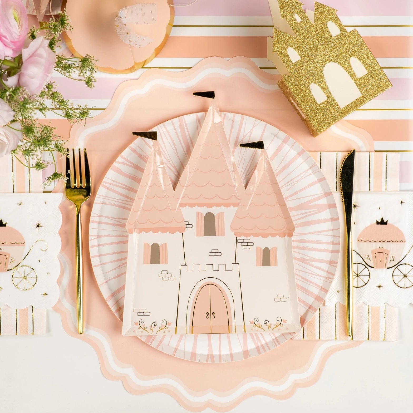 Princess castle place setting on pink striped table runner for a princess party