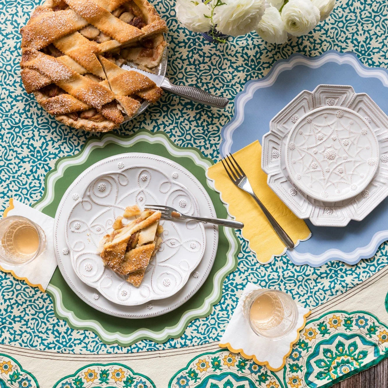 Blue and green table with pie and green edge thanksgiving napkins, classic cocktail size