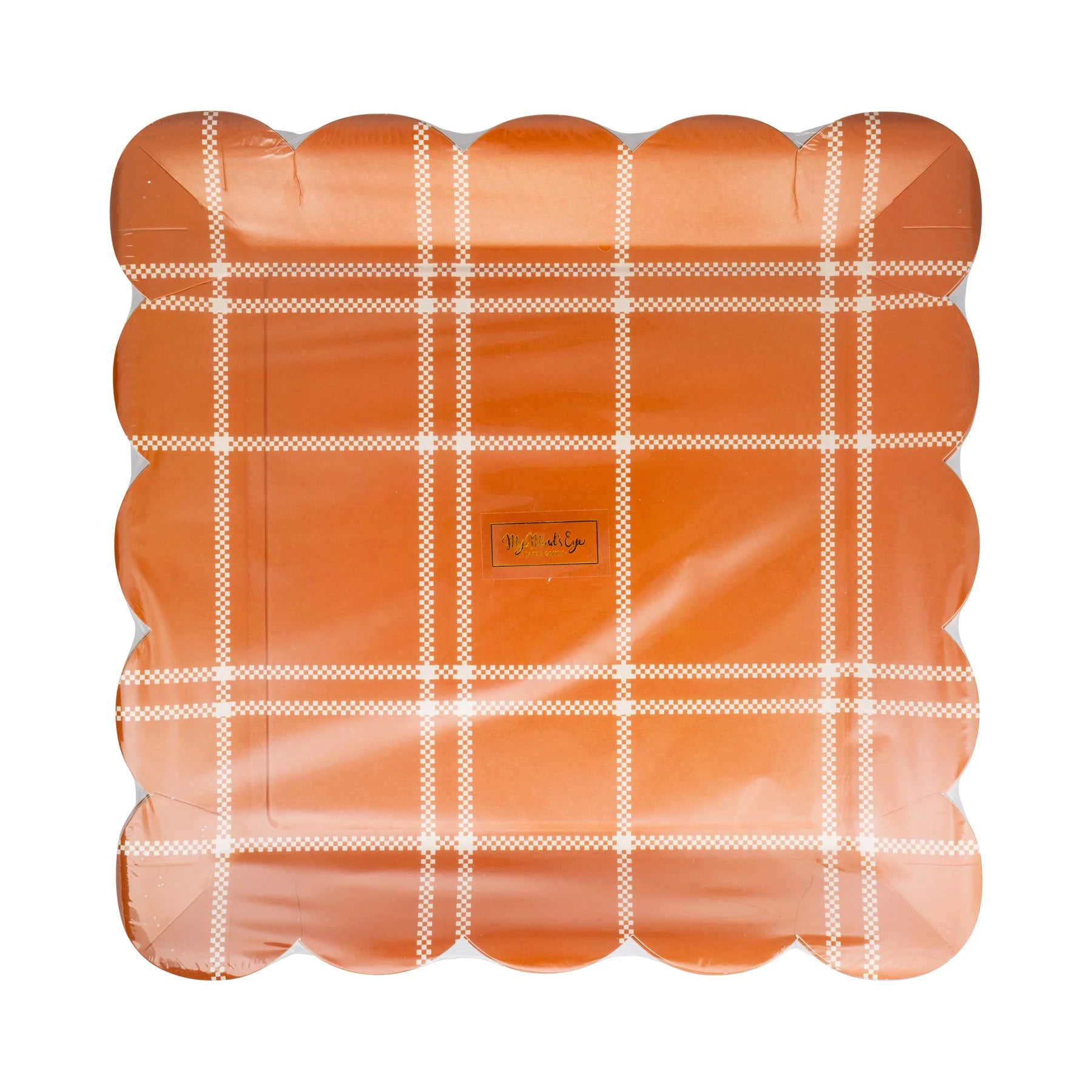 Front view of rust orange plaid paper plates with scalloped edges in clear wrap.