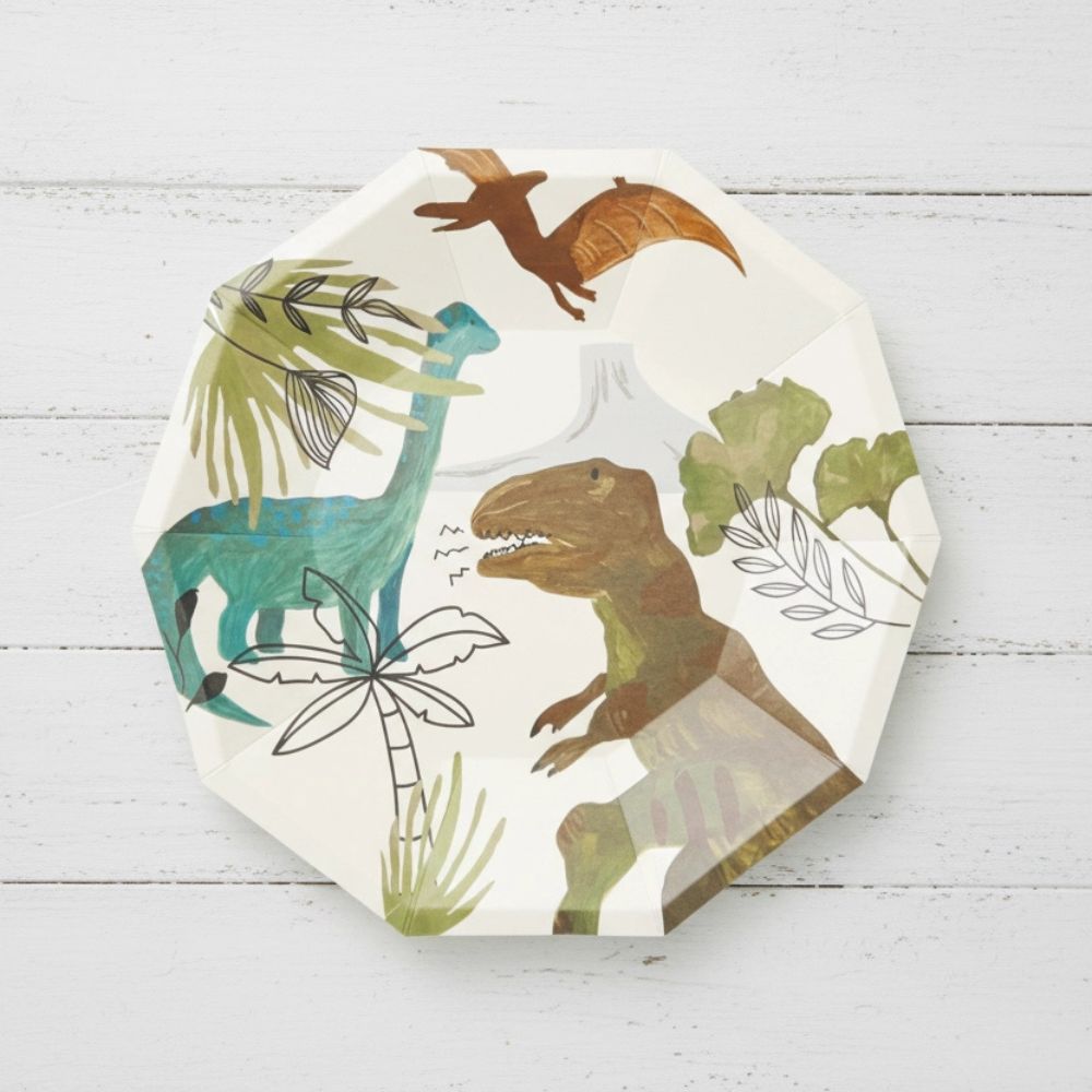pastel dinosaur dessert plate on white wood background
