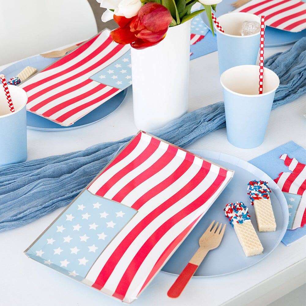 Patriotic dinner plate with stars and stripes on party table
