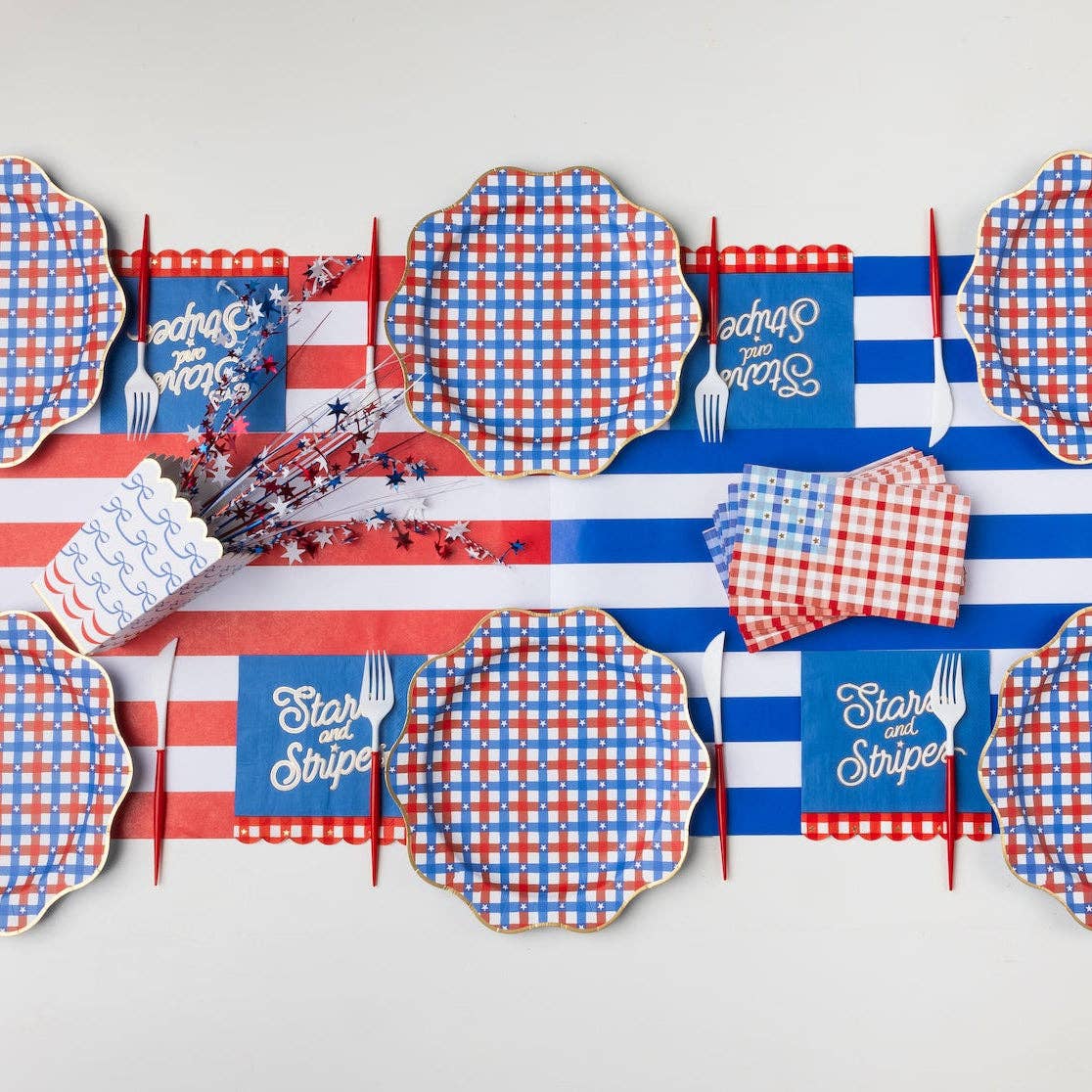 patriotic treat box styled on 4th of July party table with decorations.
